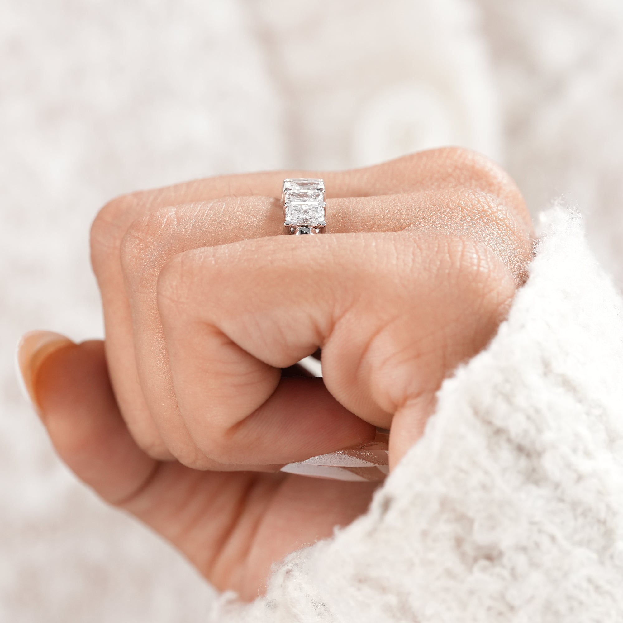 Classic radiant diamond wedding band with high polish finish.