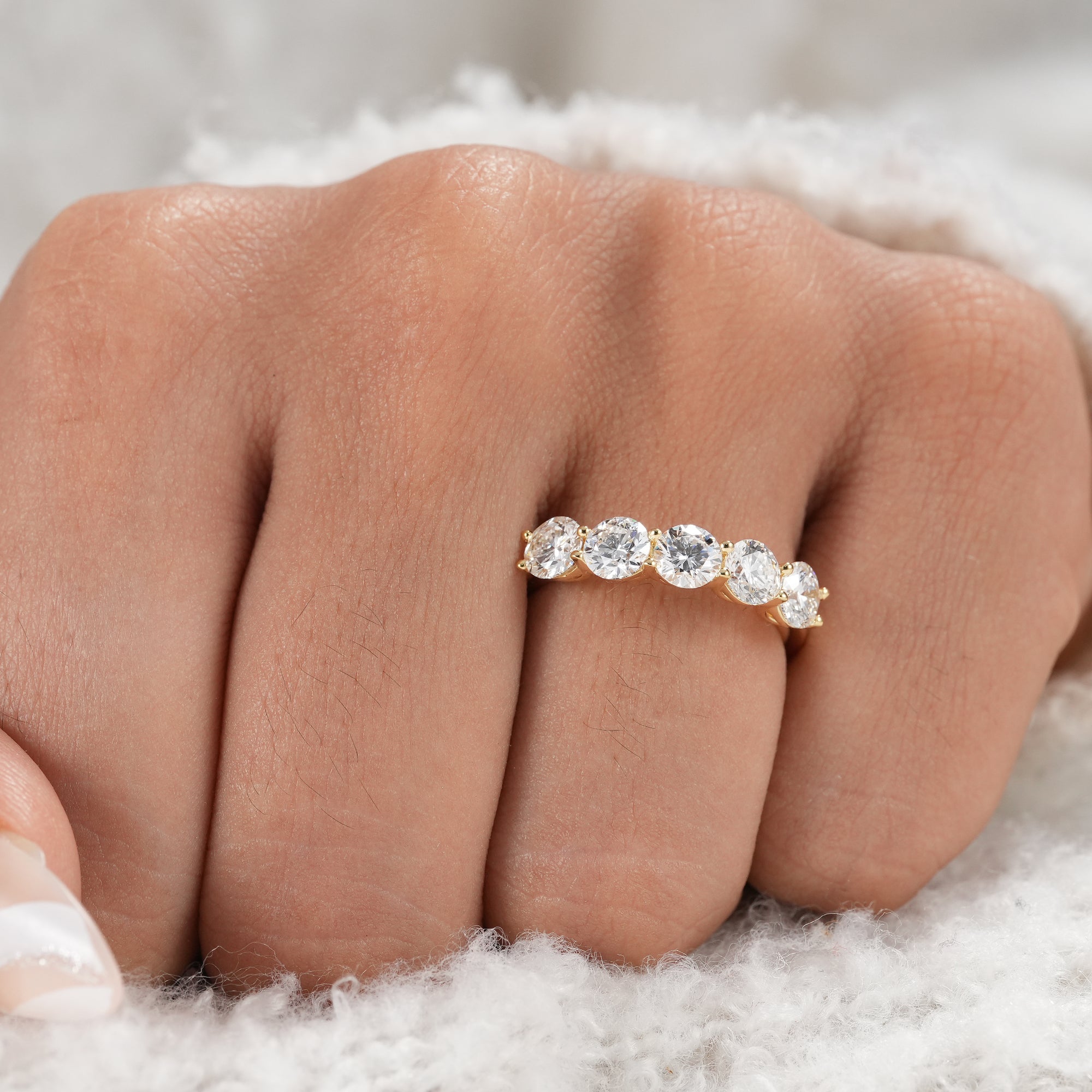 Classic five stone round diamond anniversary band.