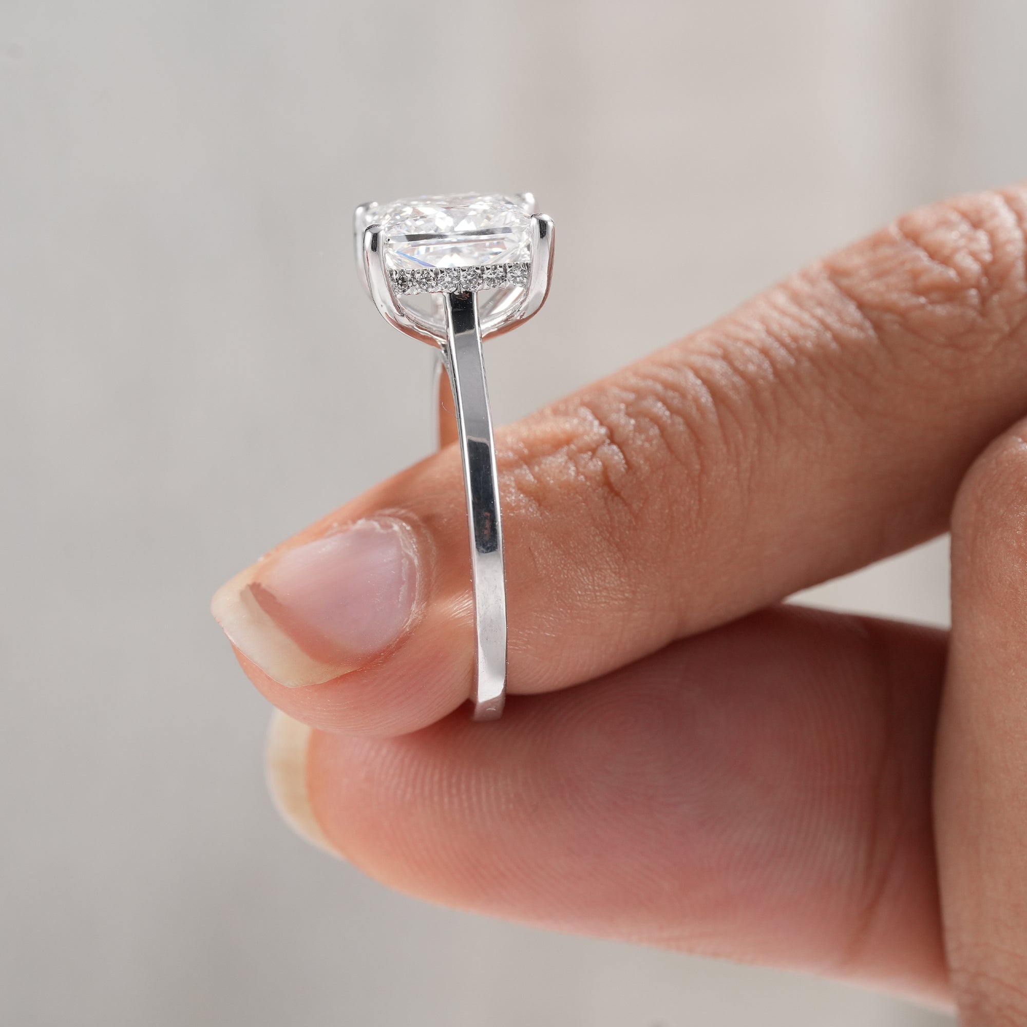 Modern princess diamond proposal ring for women.