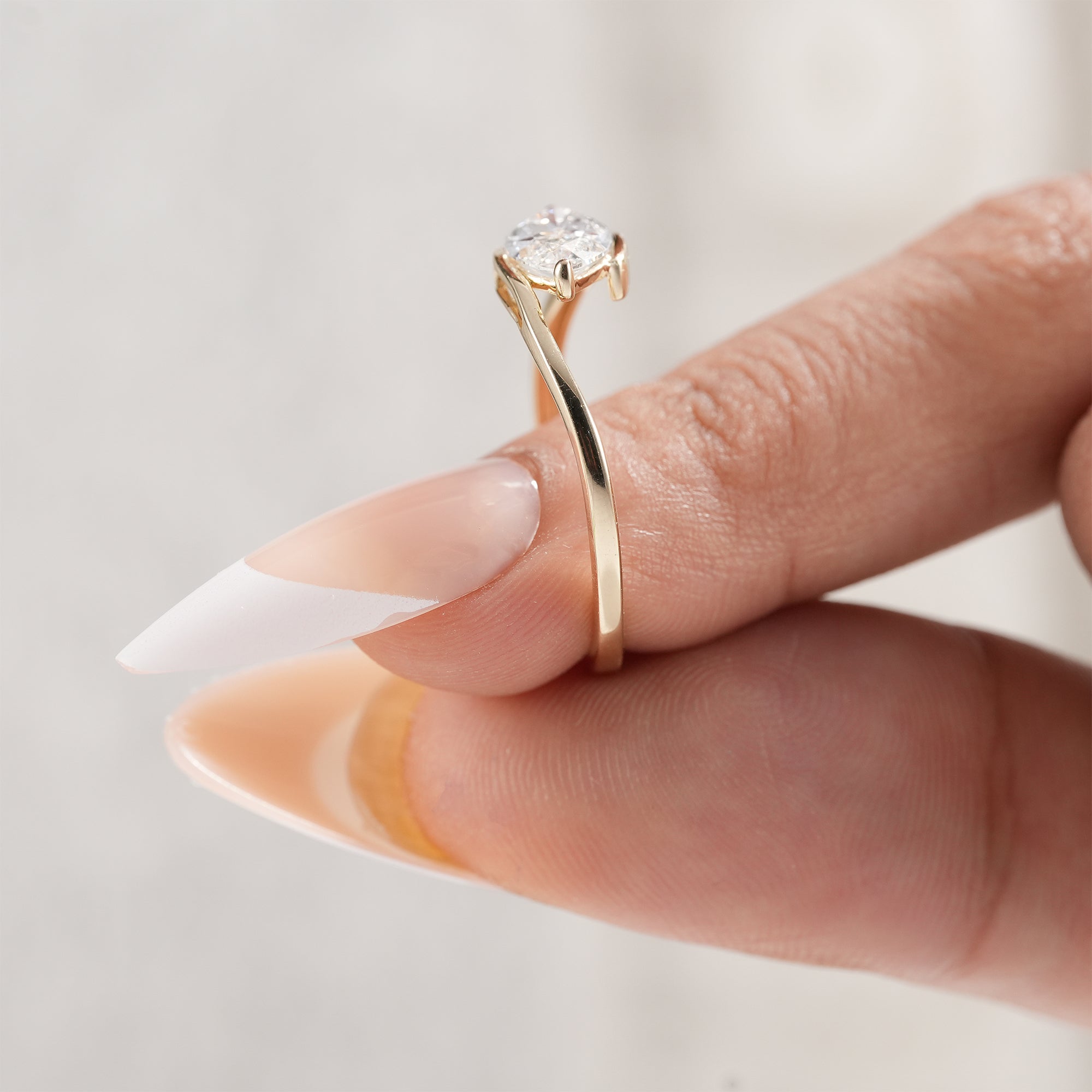 Yellow gold marquise solitaire engagement ring.