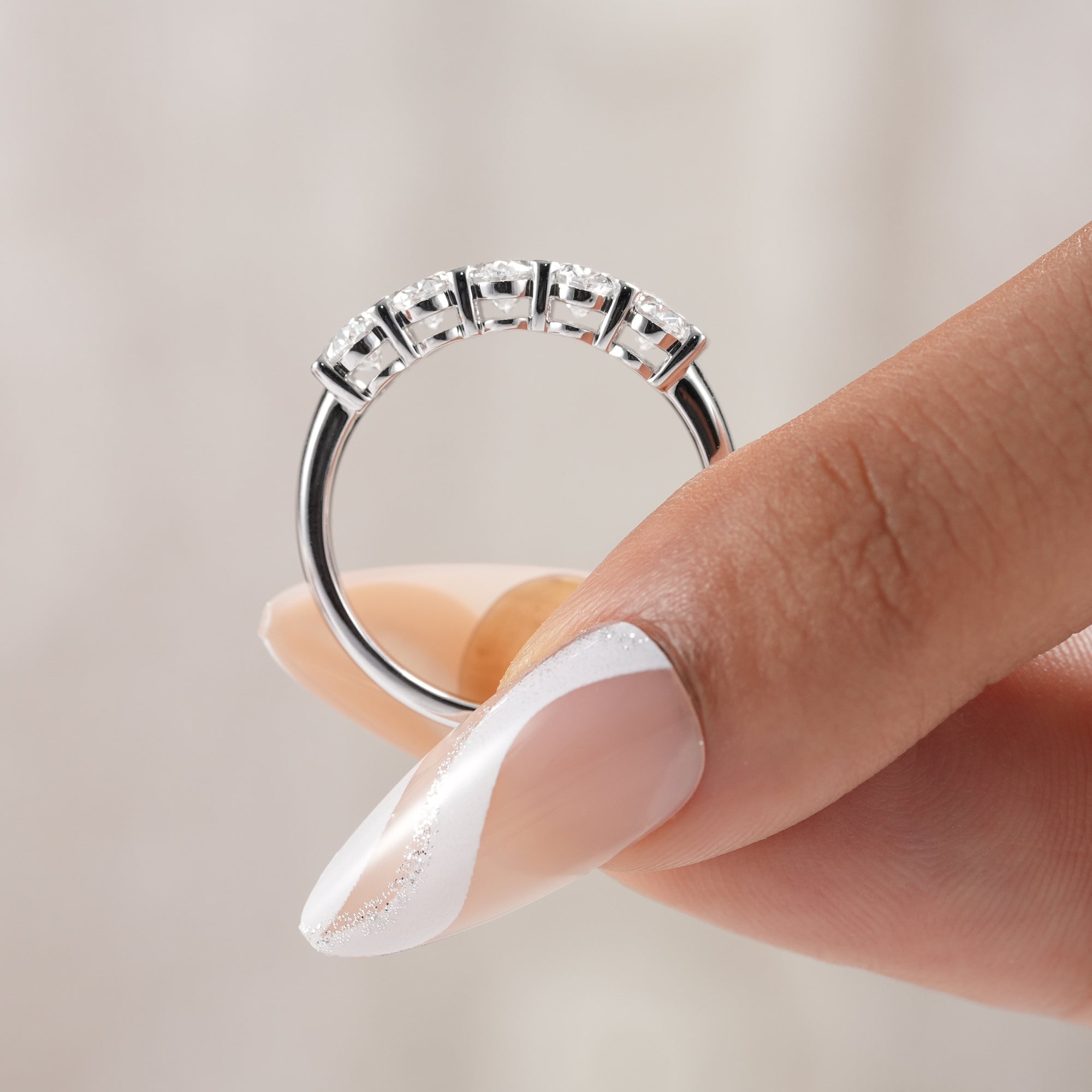 Shared prong oval lab diamond eternity-inspired ring.