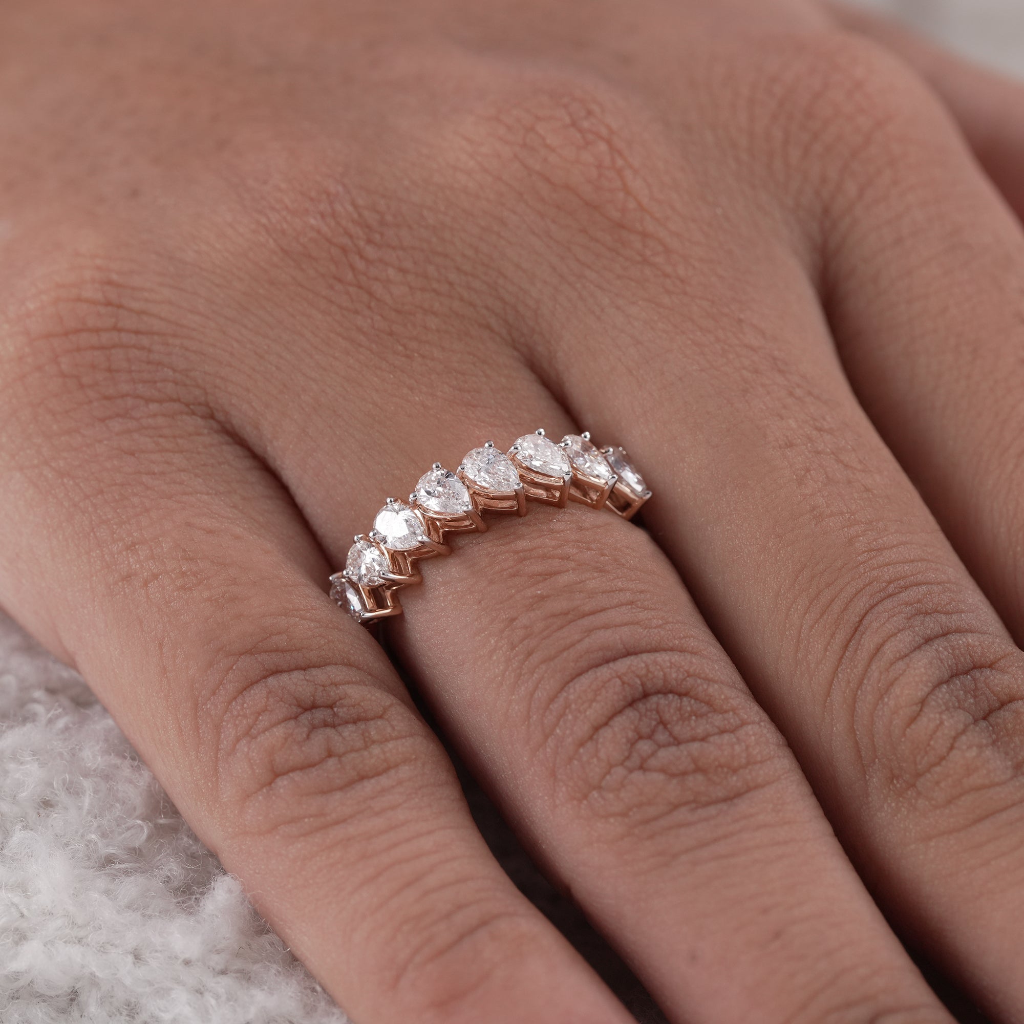 Modern pear cut diamond half eternity ring