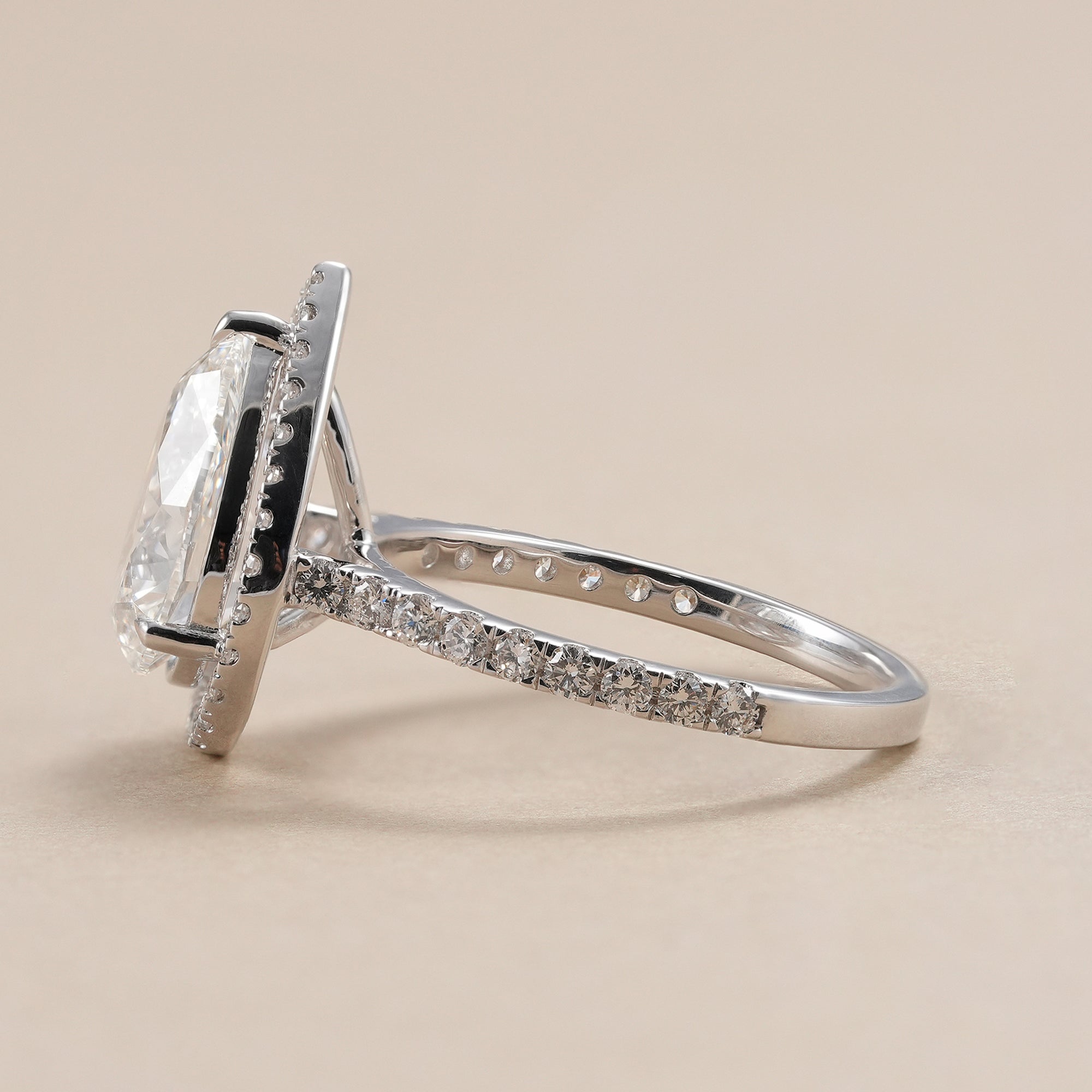 Pear cut lab grown diamond halo ring for women.