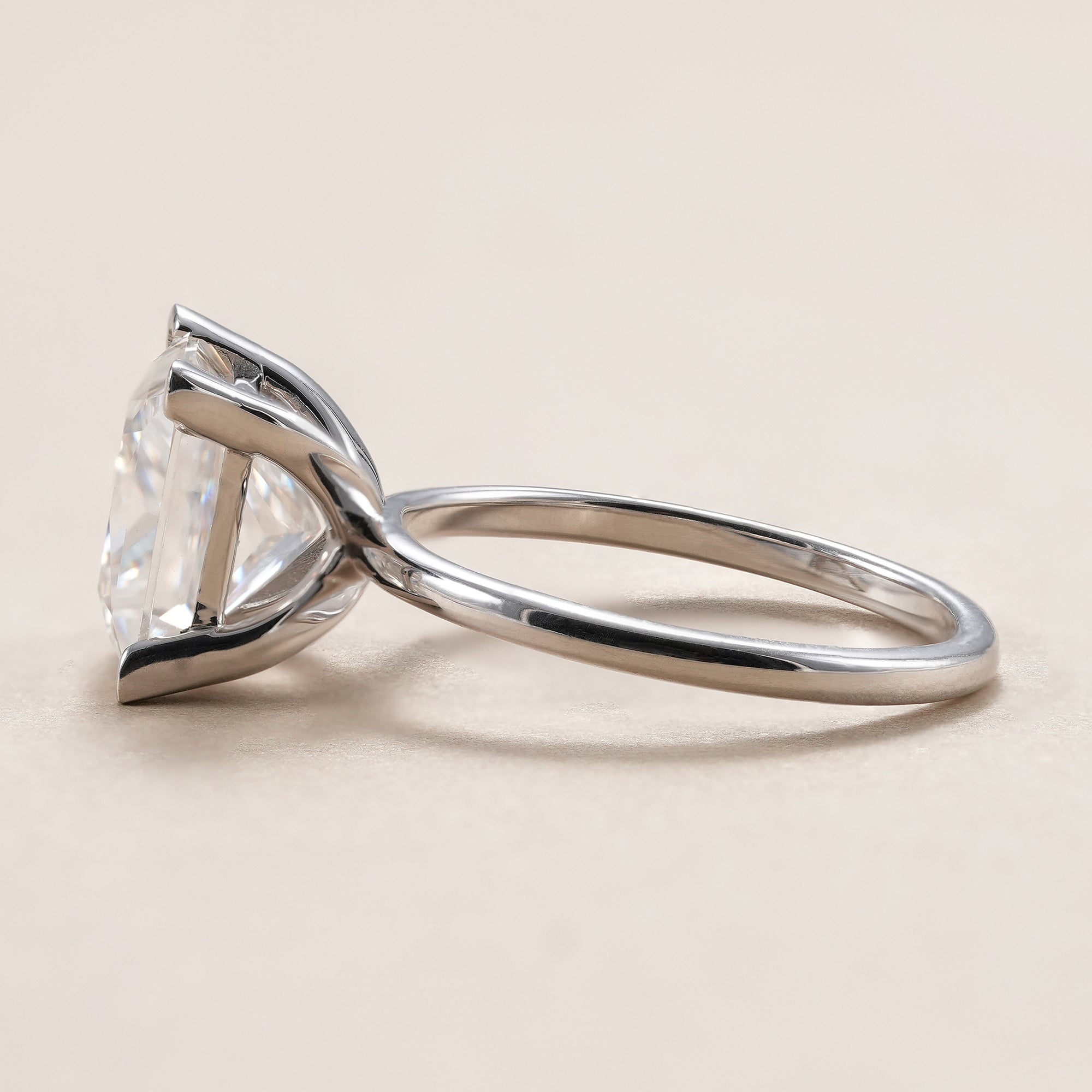 Princess cut lab diamond engagement ring with four-prong setting.
