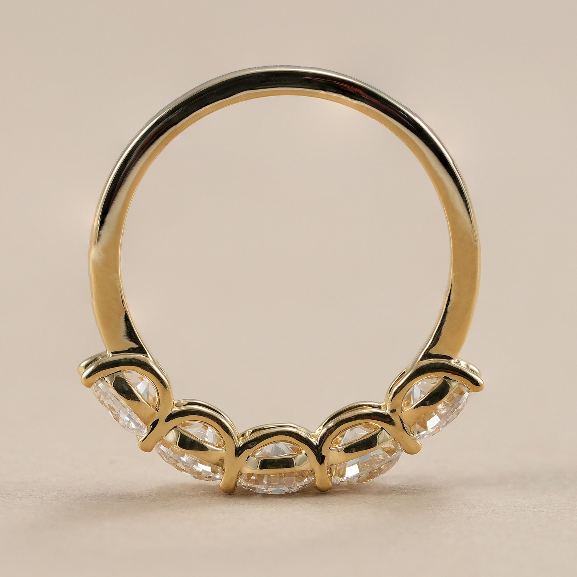 Elegant bridal wedding band featuring round lab diamonds.