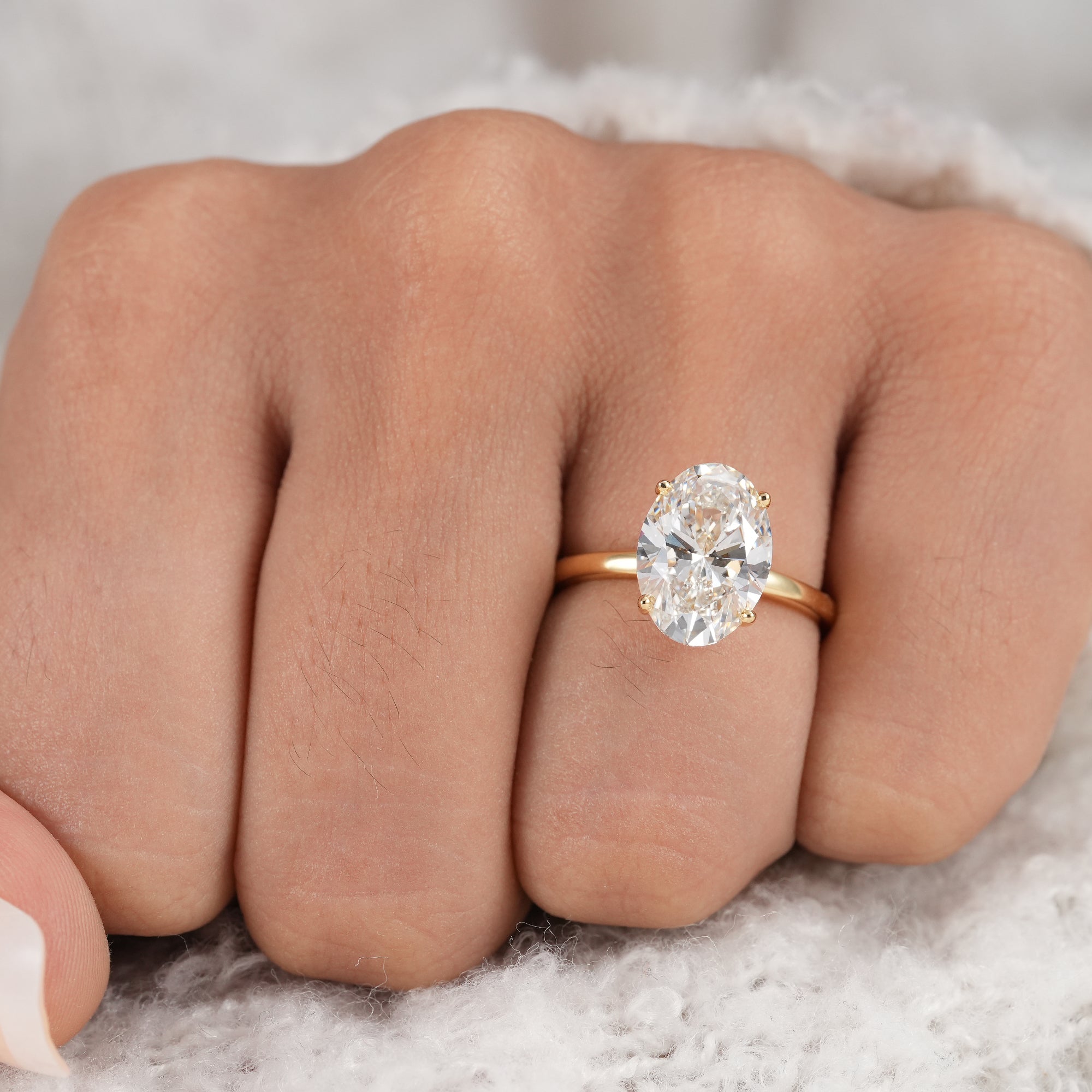 IGI certified lab grown oval diamond engagement ring.