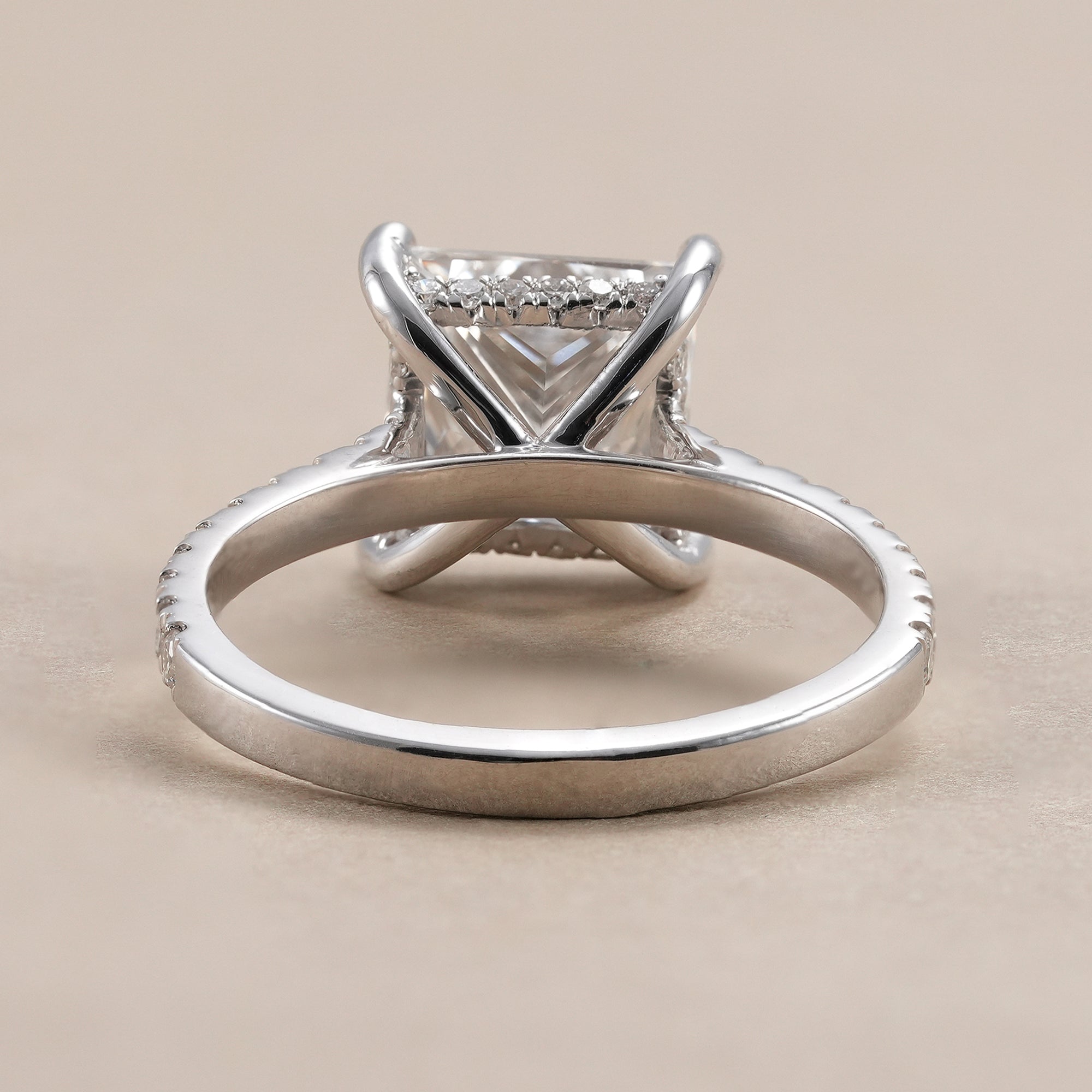 Lab grown princess diamond engagement ring with hidden halo setting.