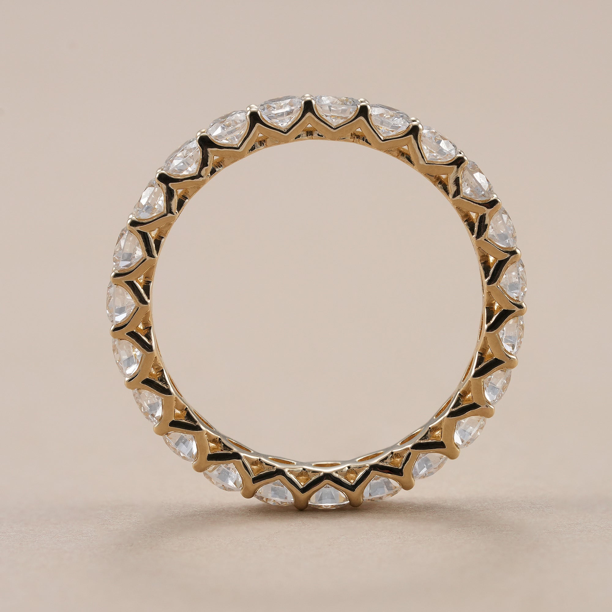 Full eternity wedding band featuring round brilliant lab grown diamonds.