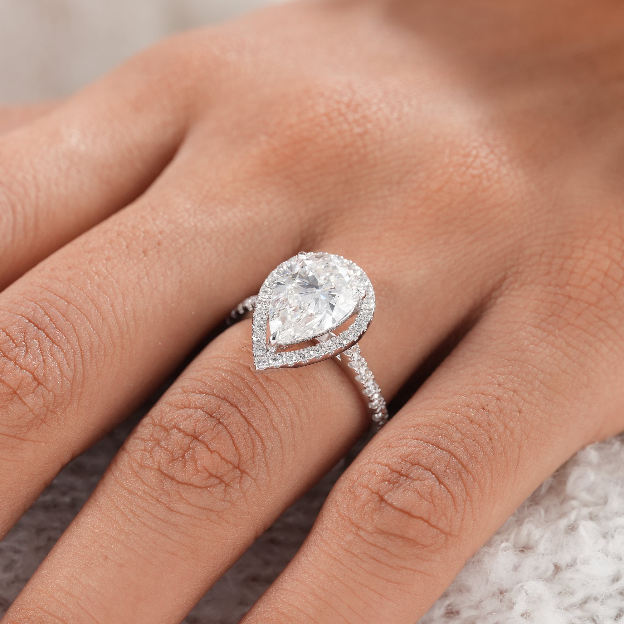 Fine jewelry pear halo engagement ring.