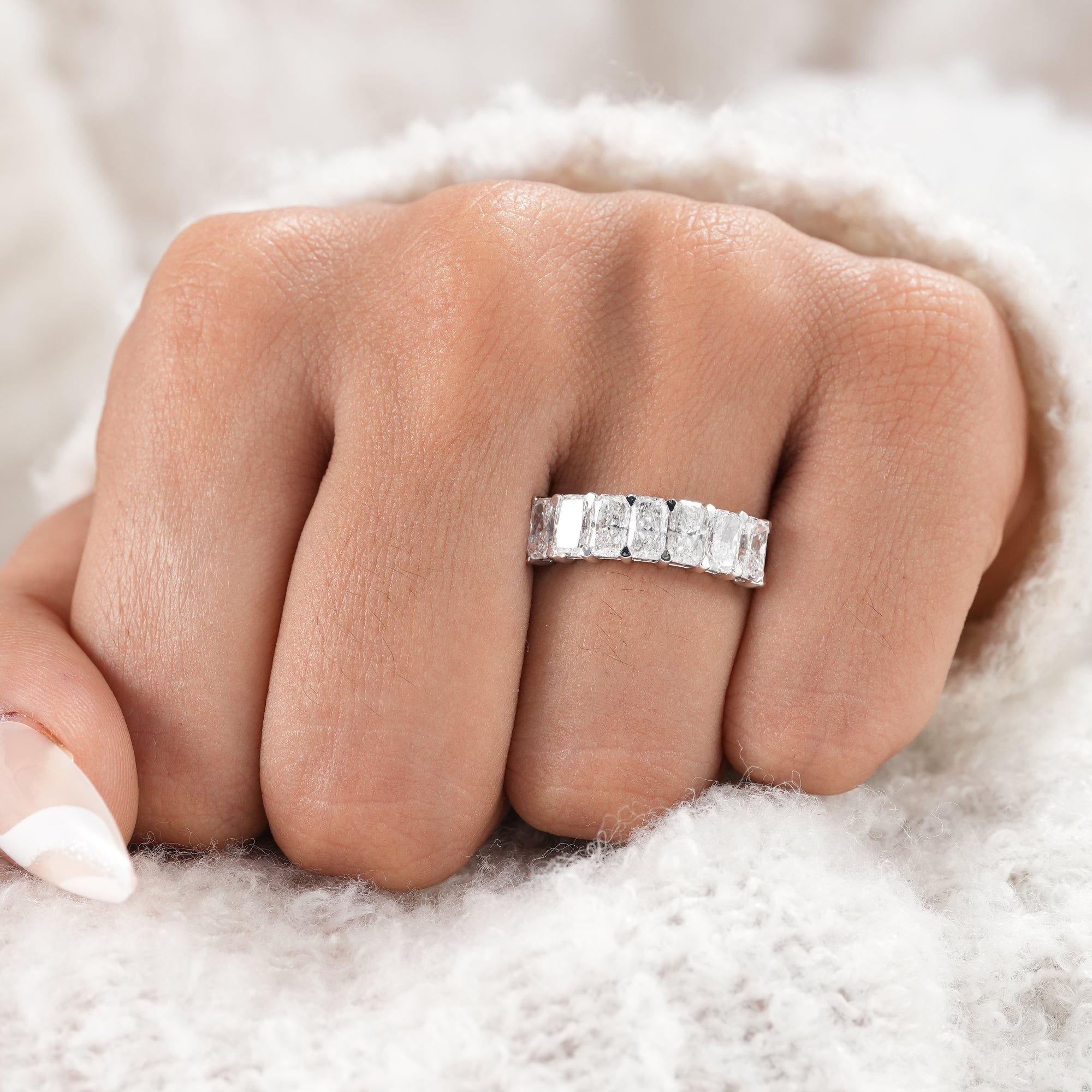 Half eternity radiant diamond band for bridal jewelry.