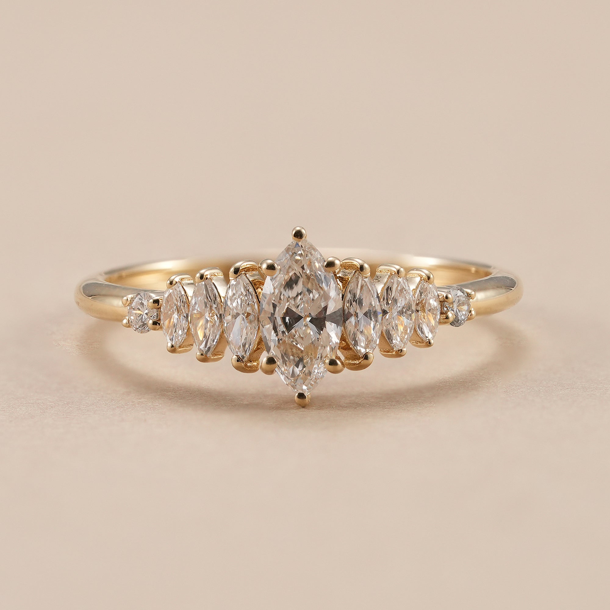 Marquise lab grown diamond engagement ring with seven stone diamond design.