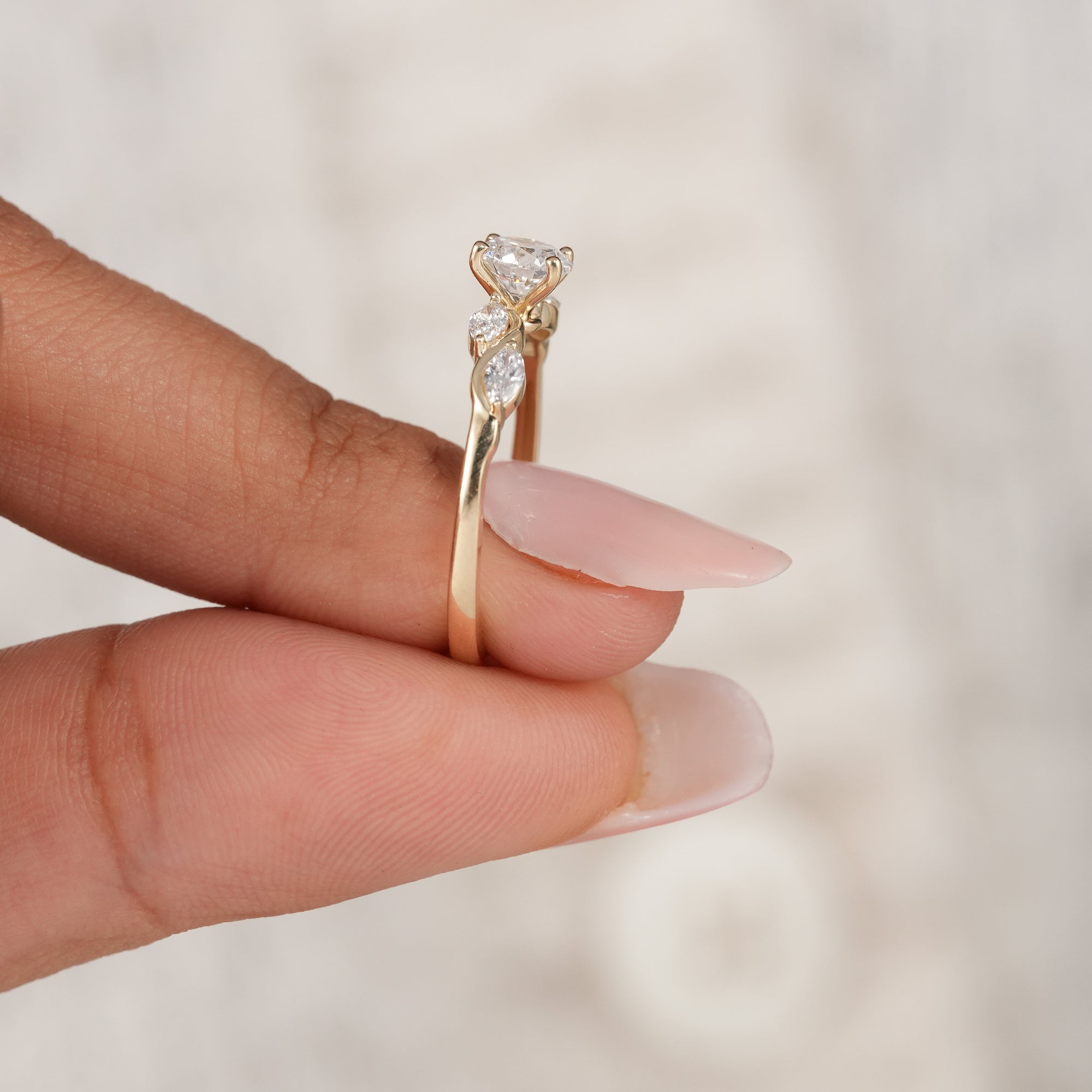 Minimalist round solitaire engagement ring in solid gold.