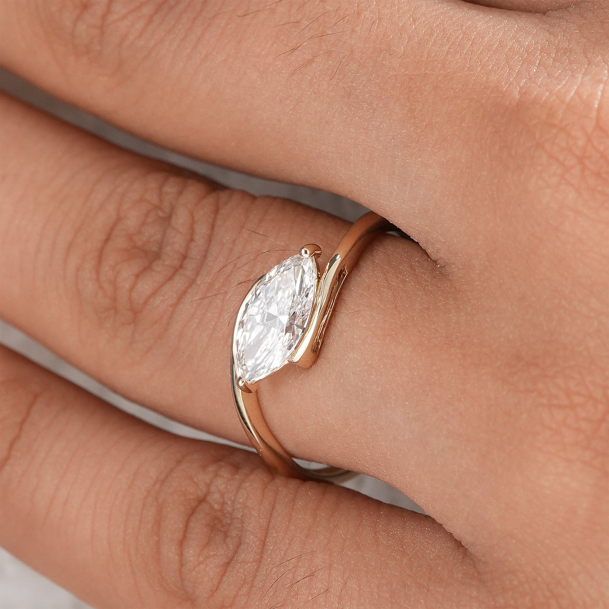 Handcrafted marquise lab diamond solitaire ring.