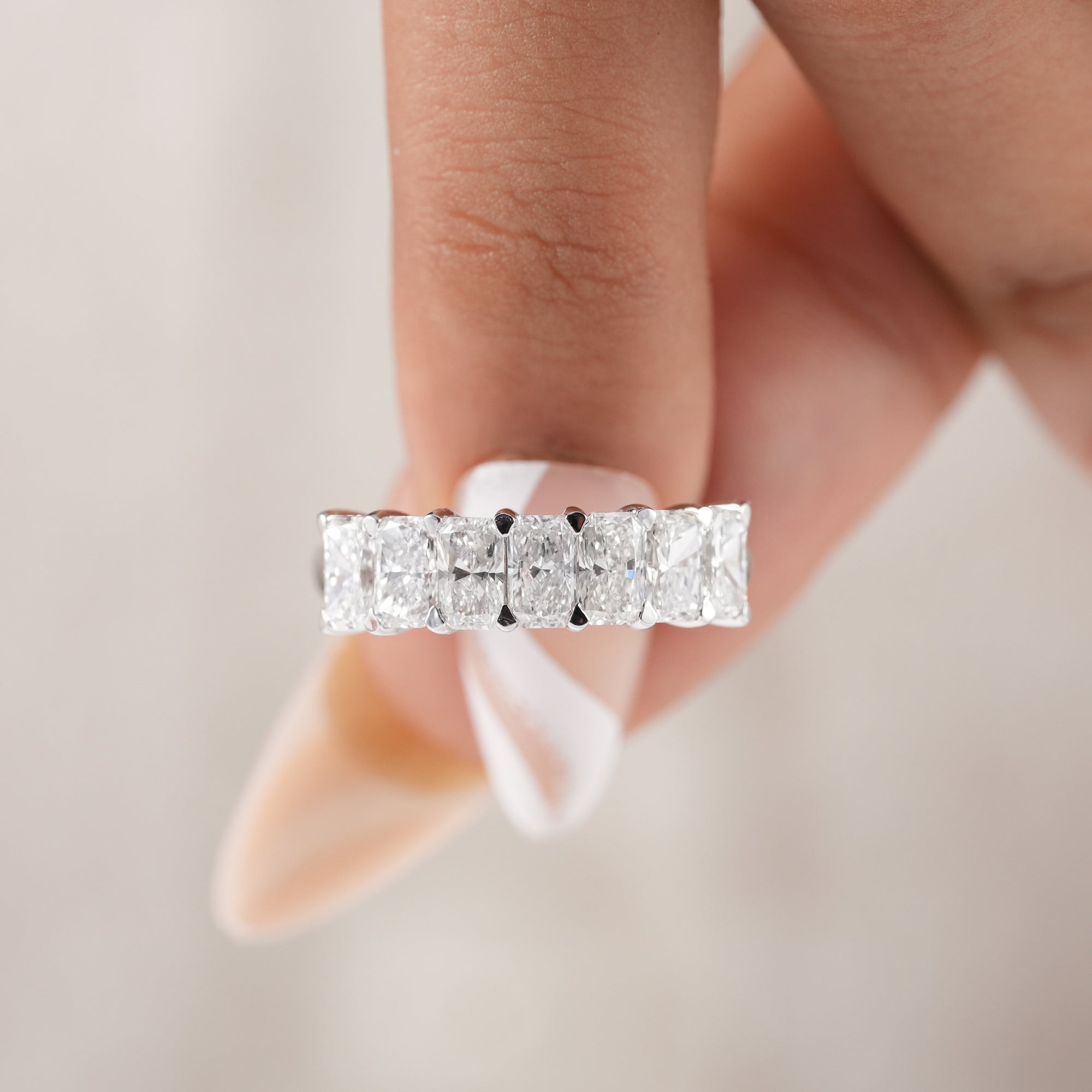 Luxury seven stone radiant diamond bridal band.