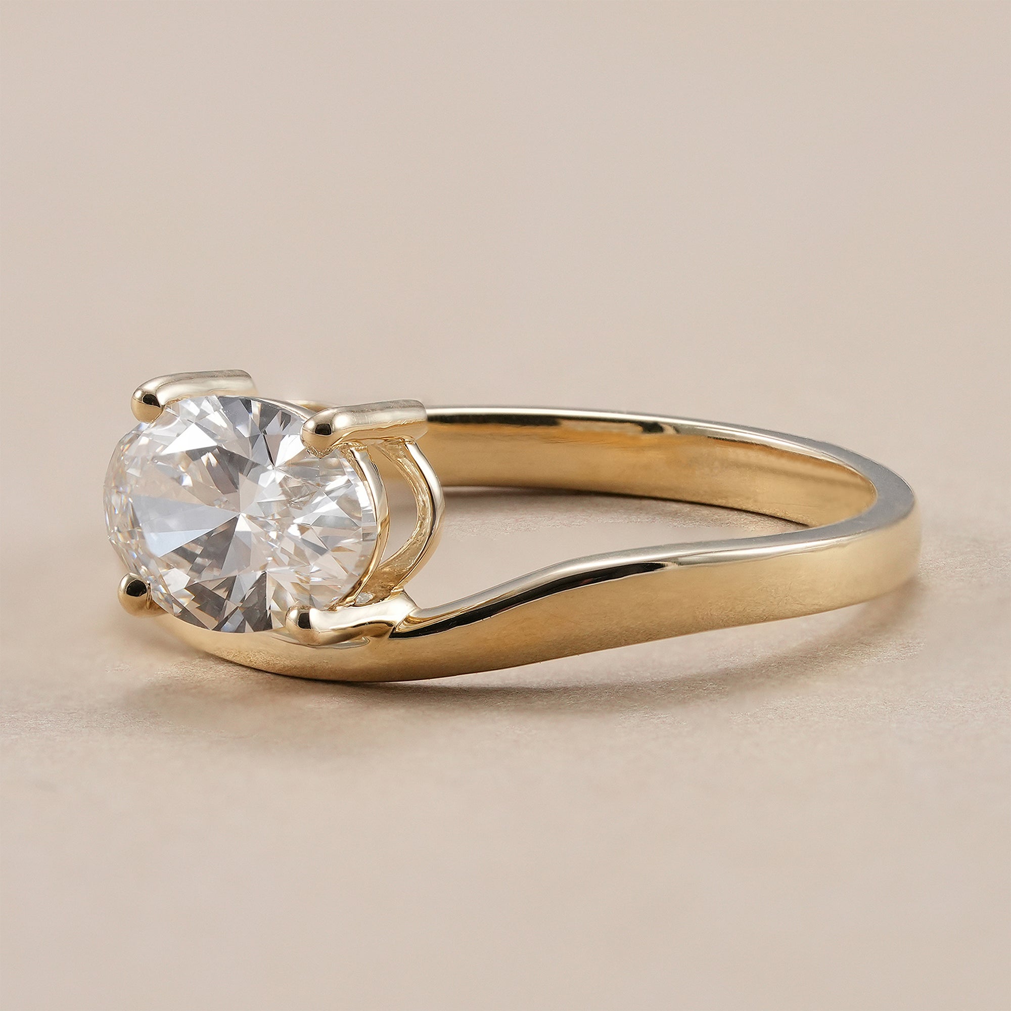 Soft V shaped oval solitaire engagement ring with lab grown diamond.