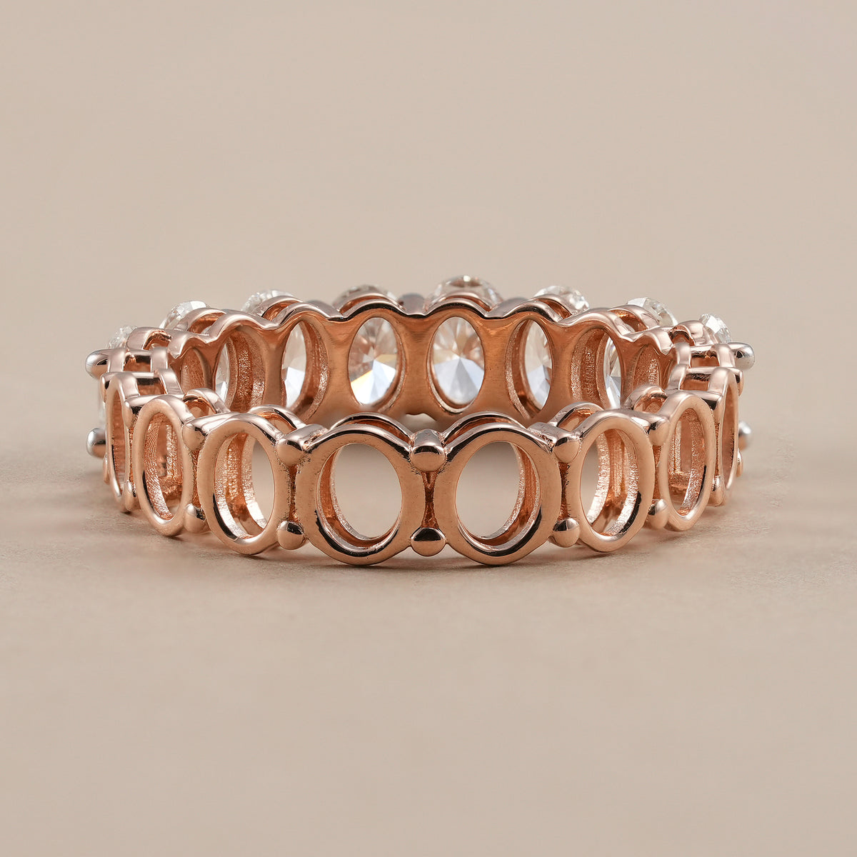 Elegant oval diamond wedding band with continuous sparkle.