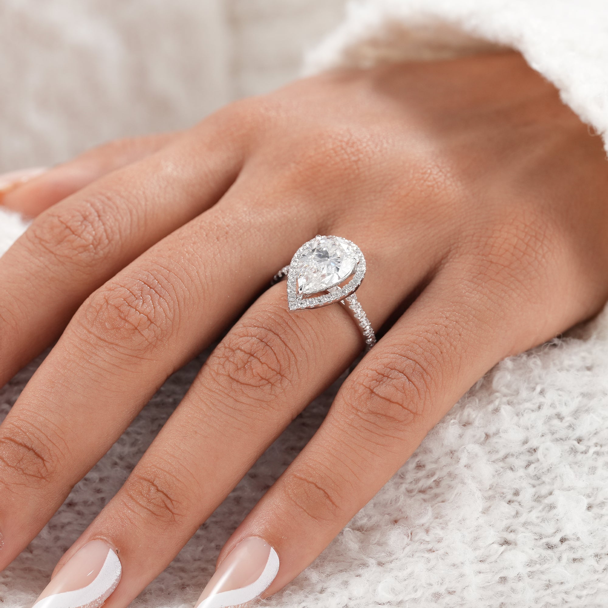 White gold pear cut lab grown diamond ring.