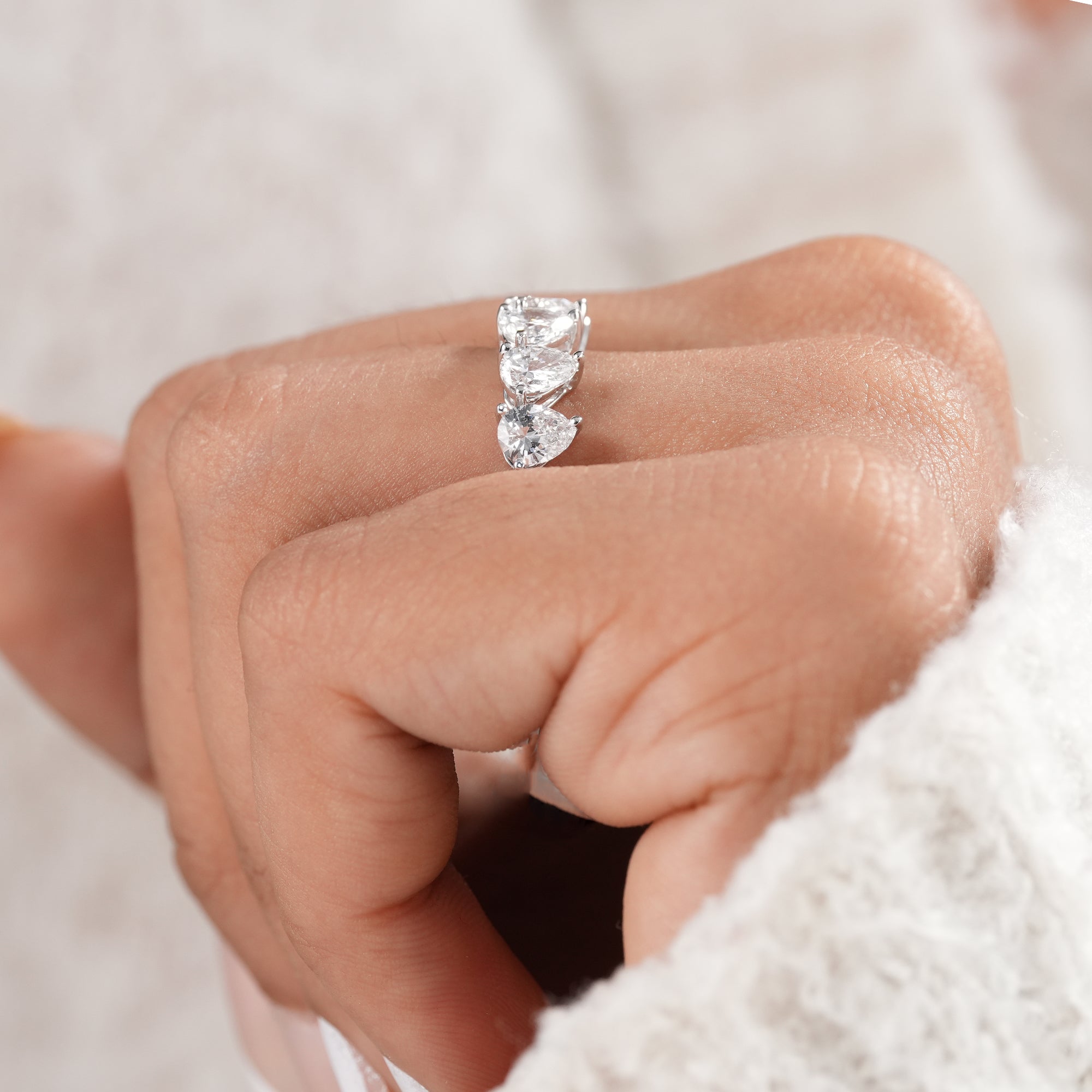 Handmade pear lab diamond anniversary ring.