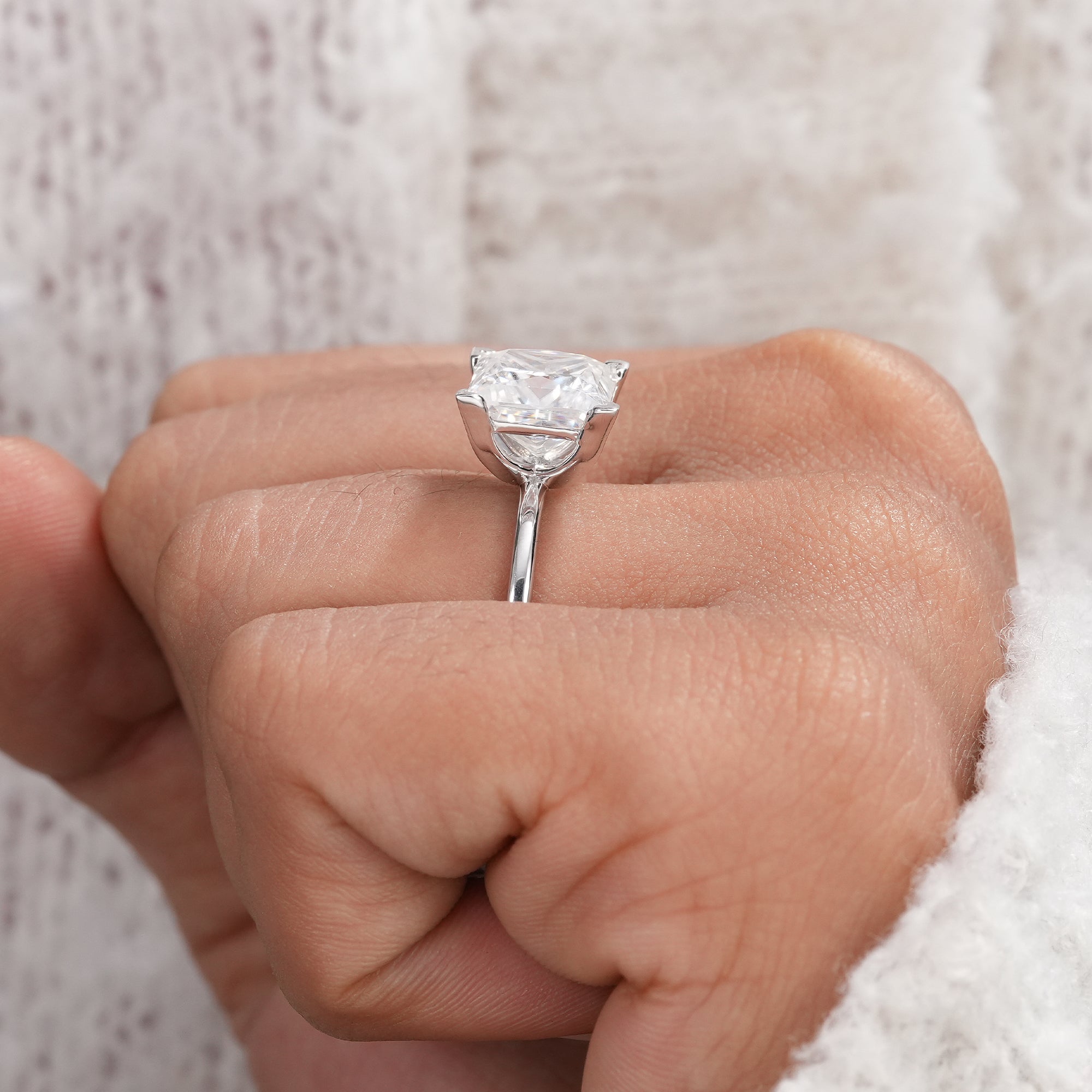 White gold princess solitaire engagement ring with IGI diamond.