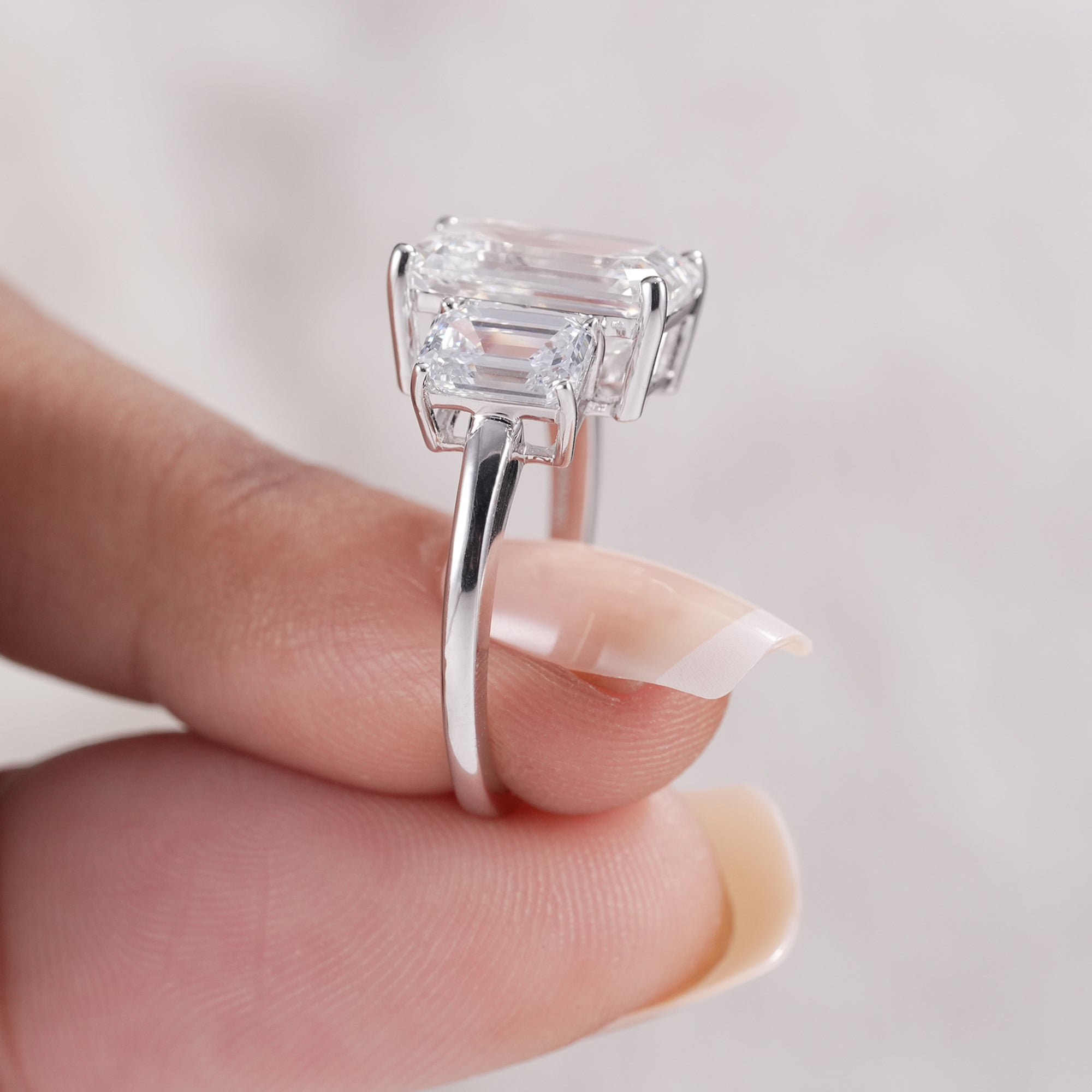 White gold three stone emerald diamond anniversary ring