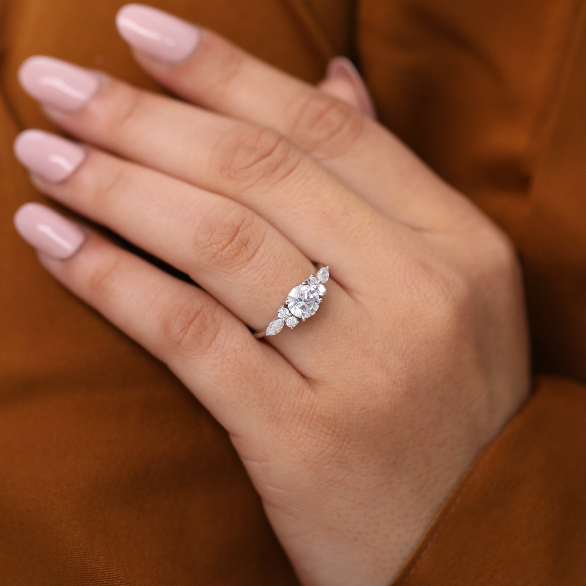 Affordable lab diamond ring for women with round center and multi-shape side stones.