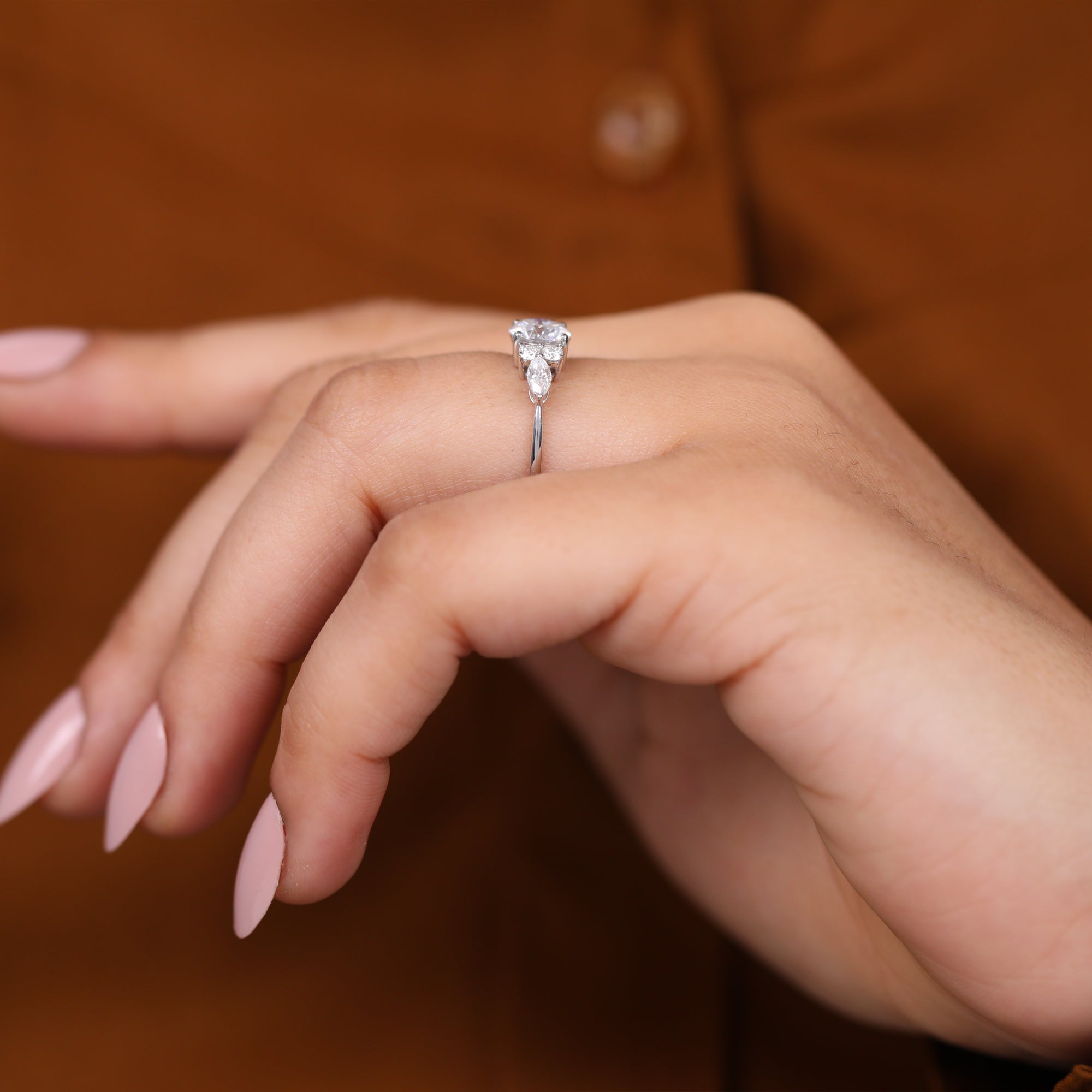 Fine jewelry lab grown diamond engagement ring with round cut center stone.