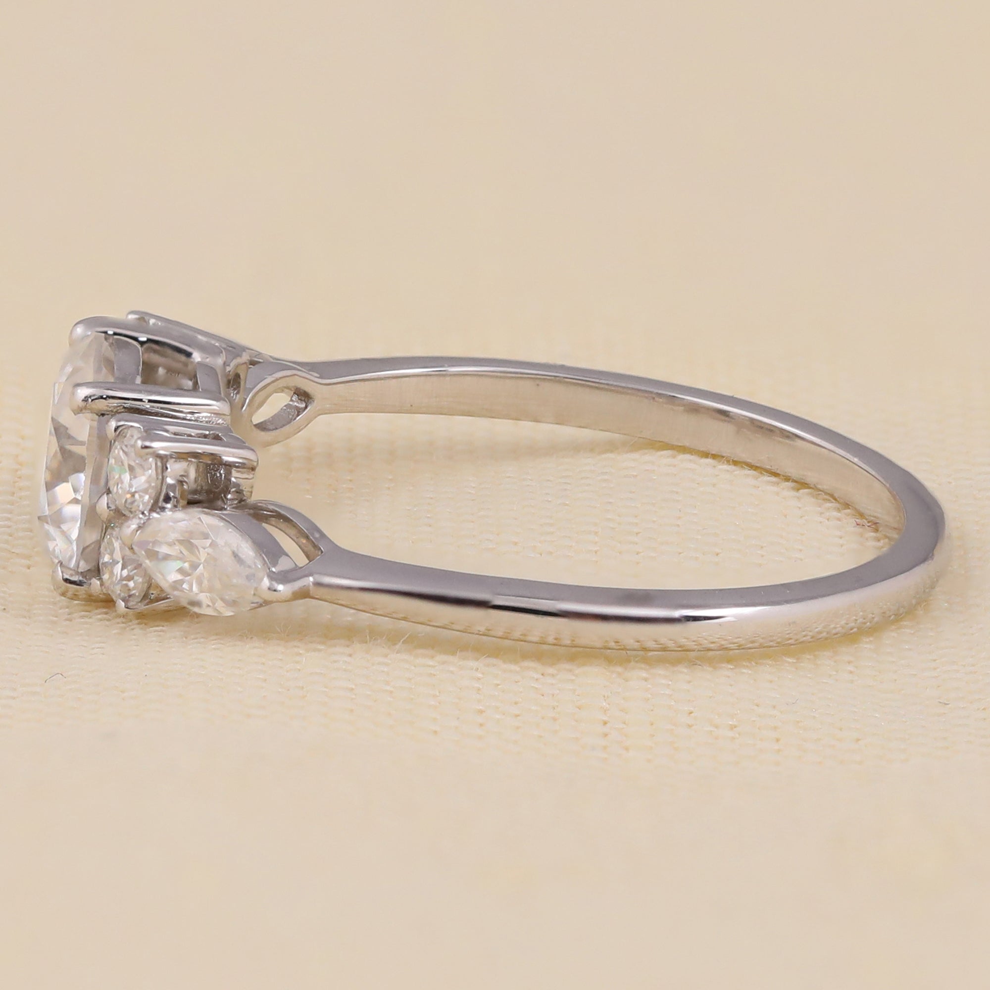 Elegant round lab grown diamond engagement ring with sparkling side stone details.