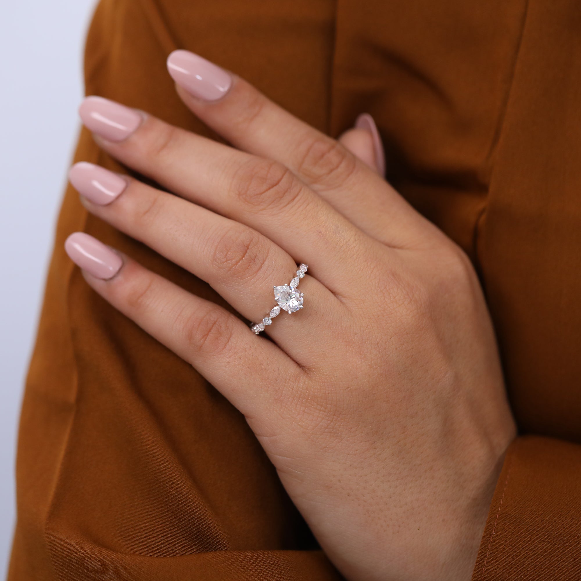Elegant pear cut lab grown diamond ring for women with side stones