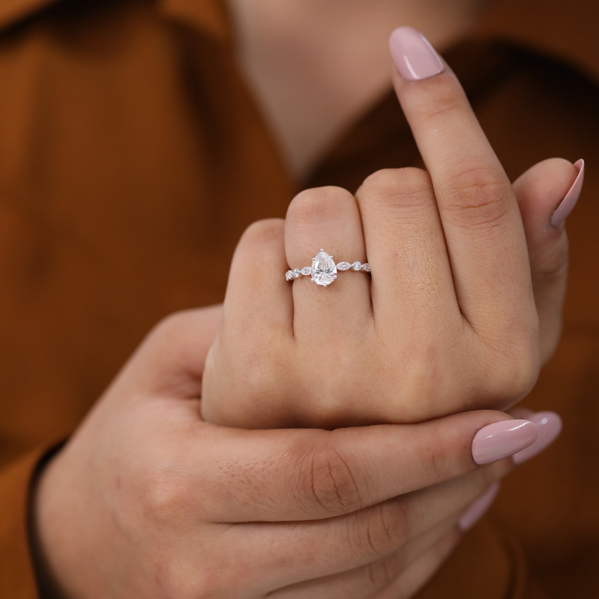 Teardrop lab grown diamond wedding ring with decorative diamond accents