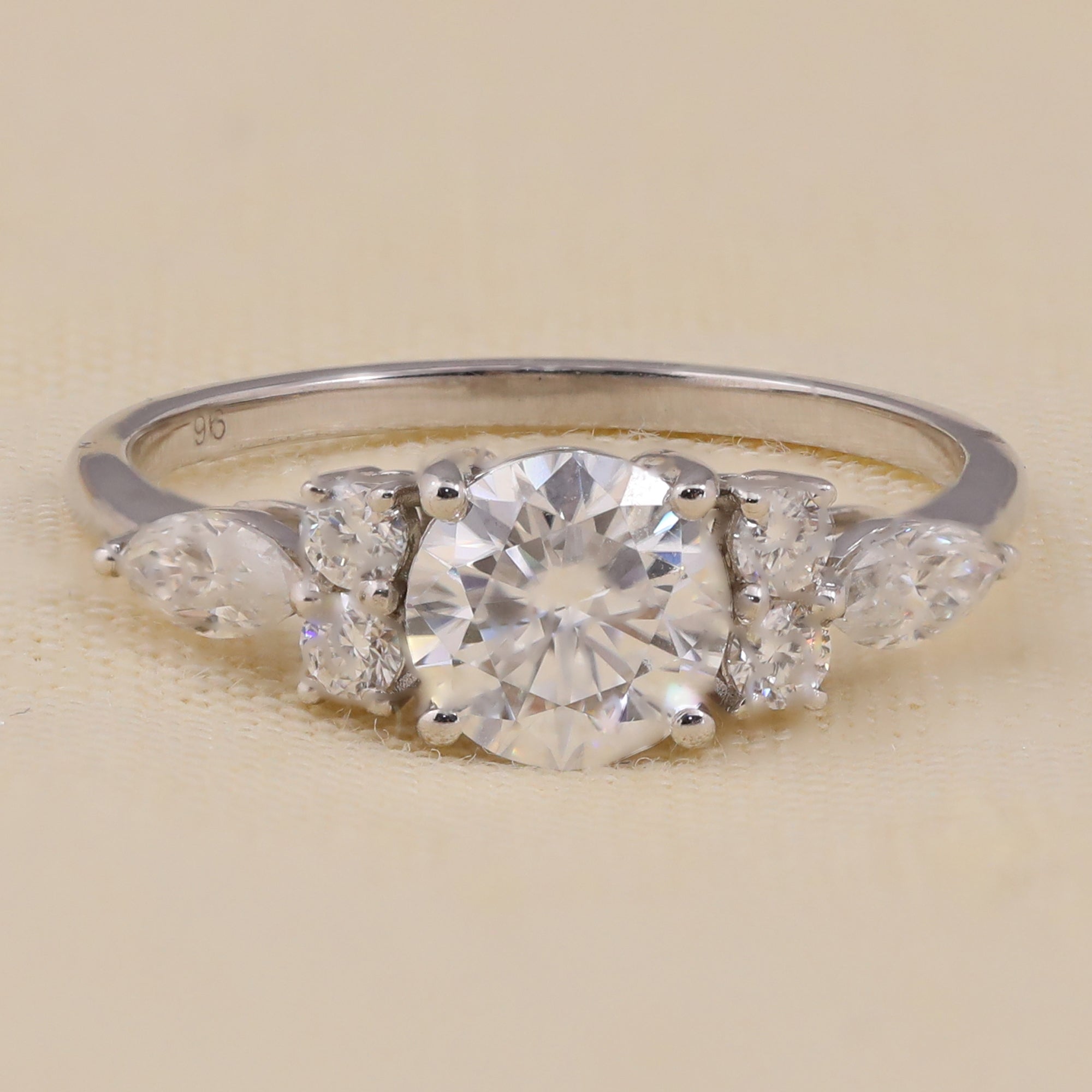 Lab grown diamond round cut engagement ring with side marquise accents for women.