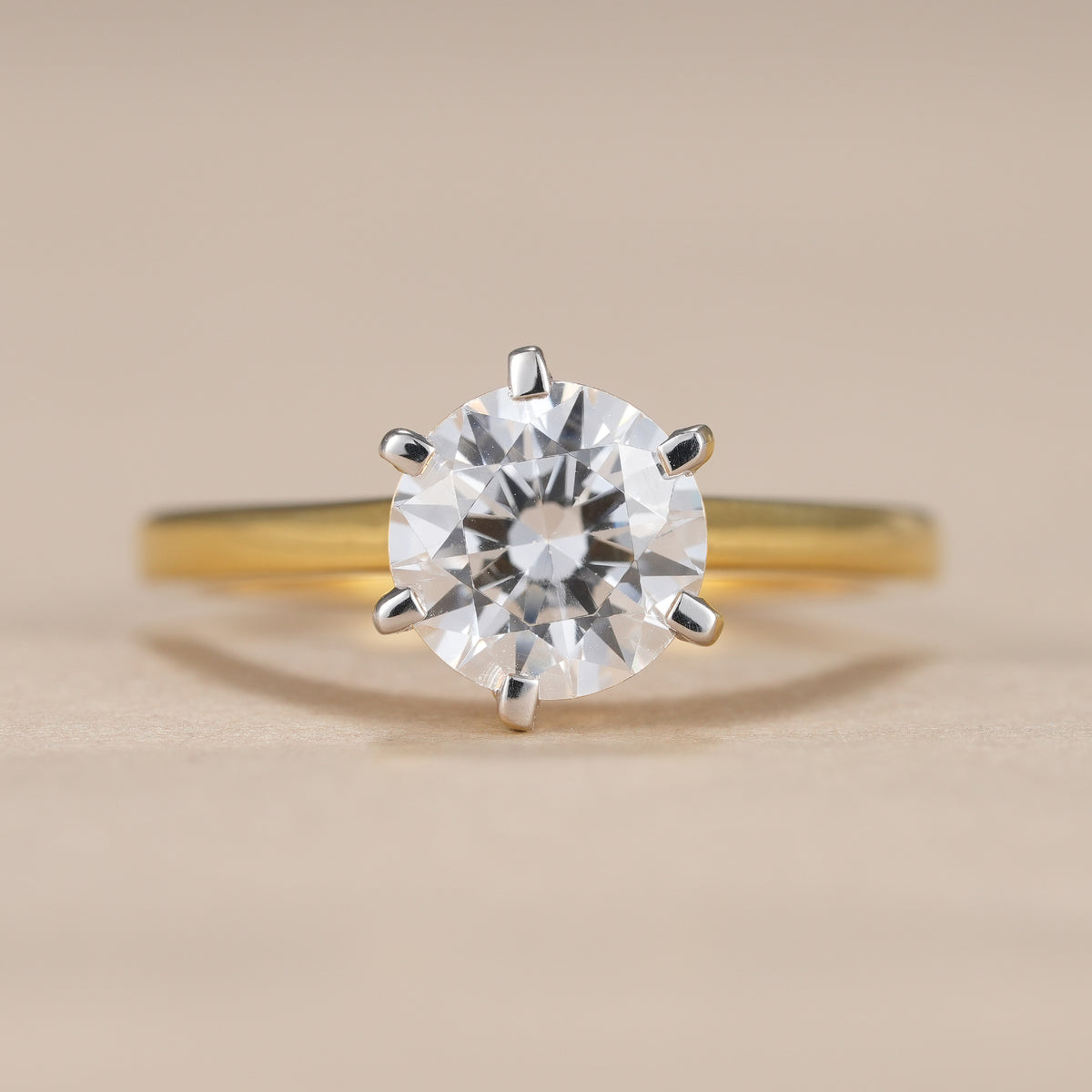 1.5 CT round lab diamond engagement ring featuring a classic six prong solitaire setting.