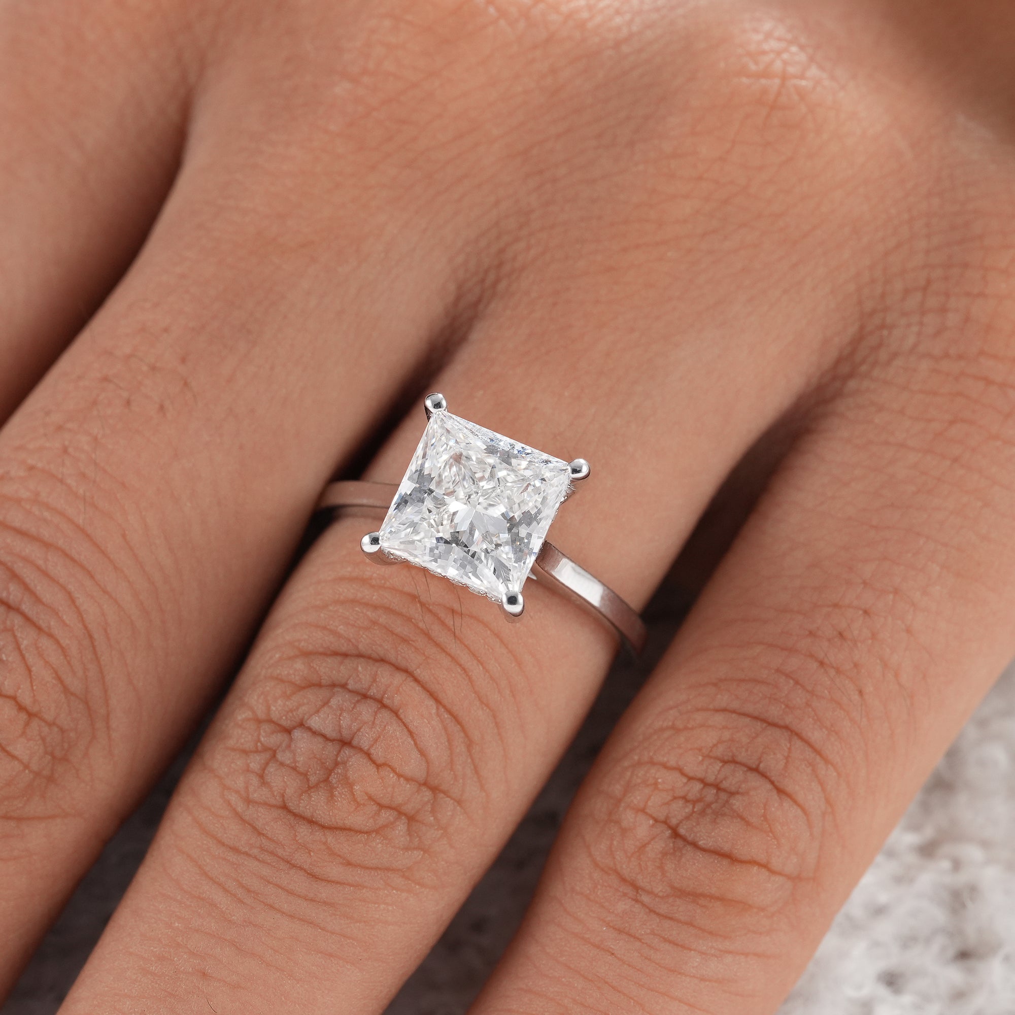 Luxury lab grown princess engagement ring with hidden halo.