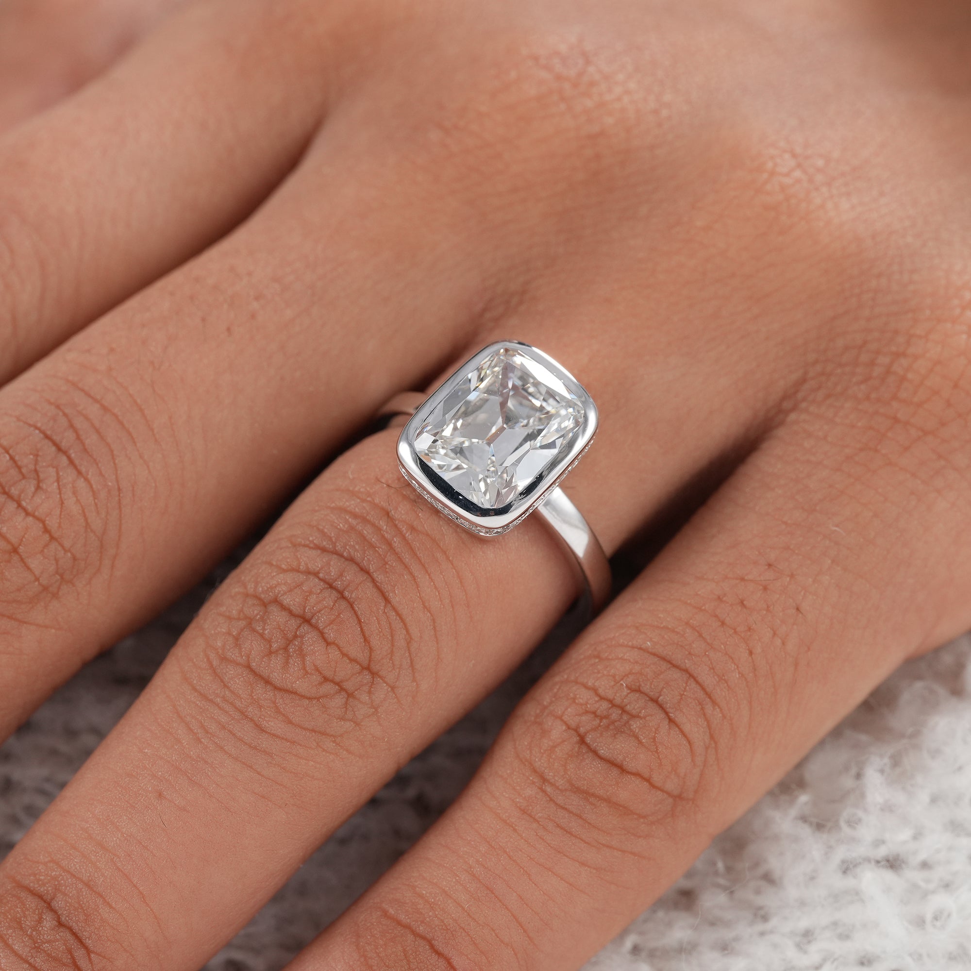 Minimalist bezel set cushion lab diamond ring.