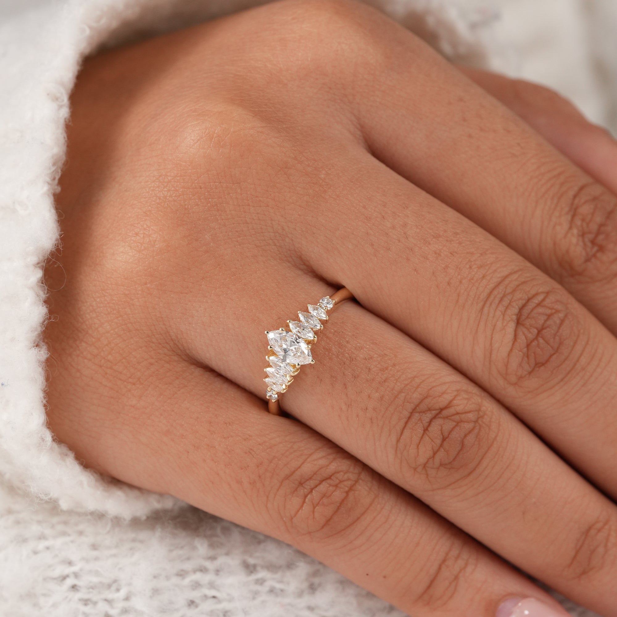 Fine jewelry marquise engagement ring with sparkling diamonds.