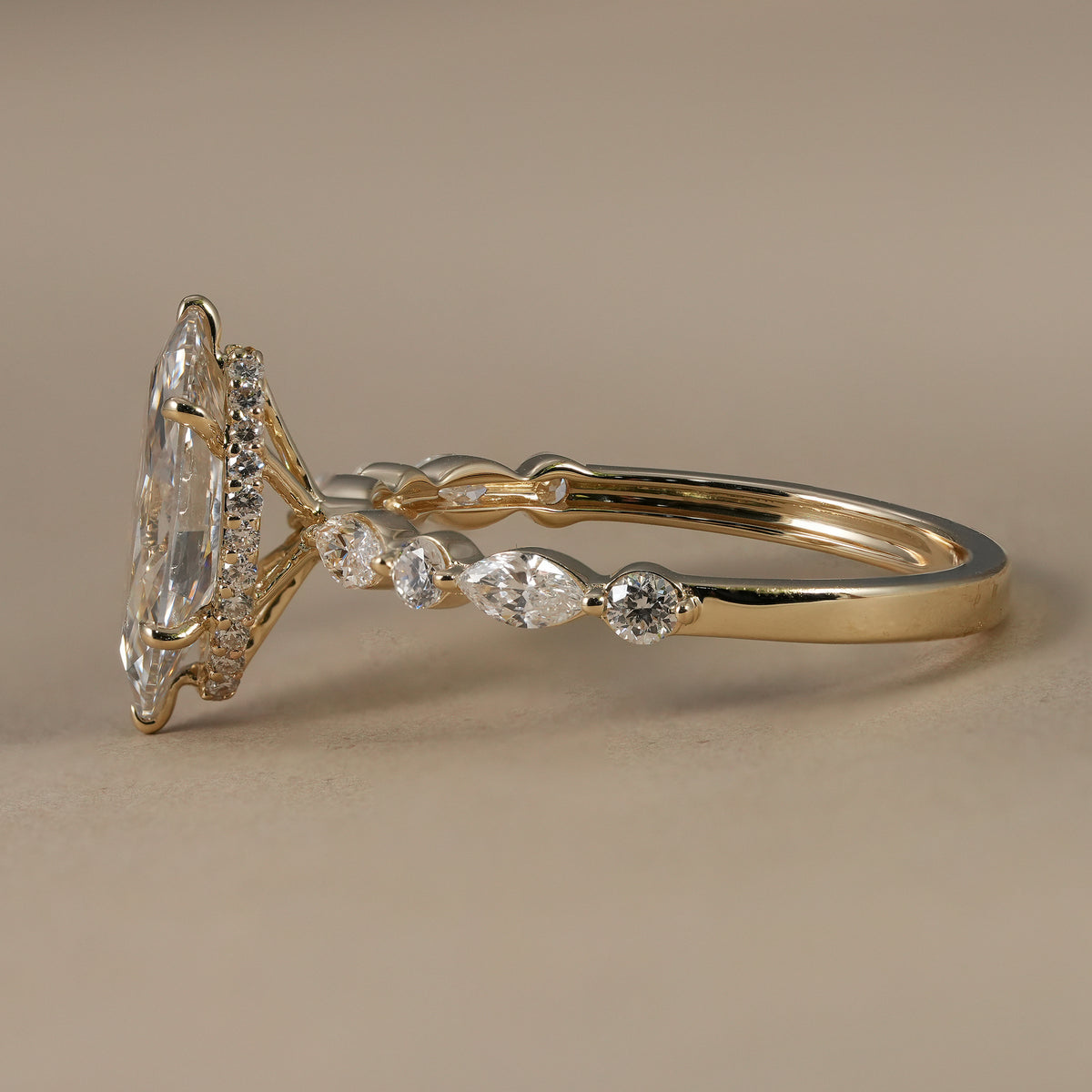 IGI certified marquise lab diamond ring crafted in solid yellow gold with hidden halo.