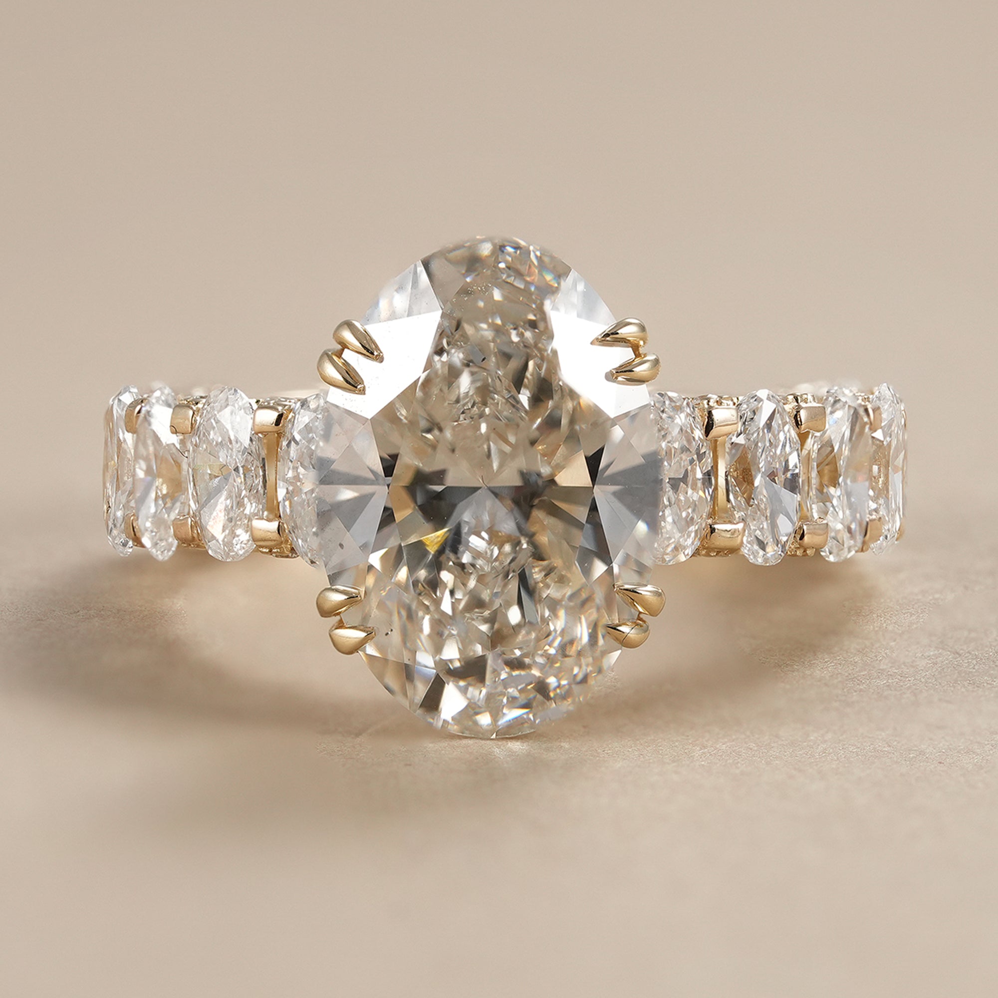 Luxury 5 CT oval lab grown diamond engagement ring with hidden halo and oval diamond accent band.