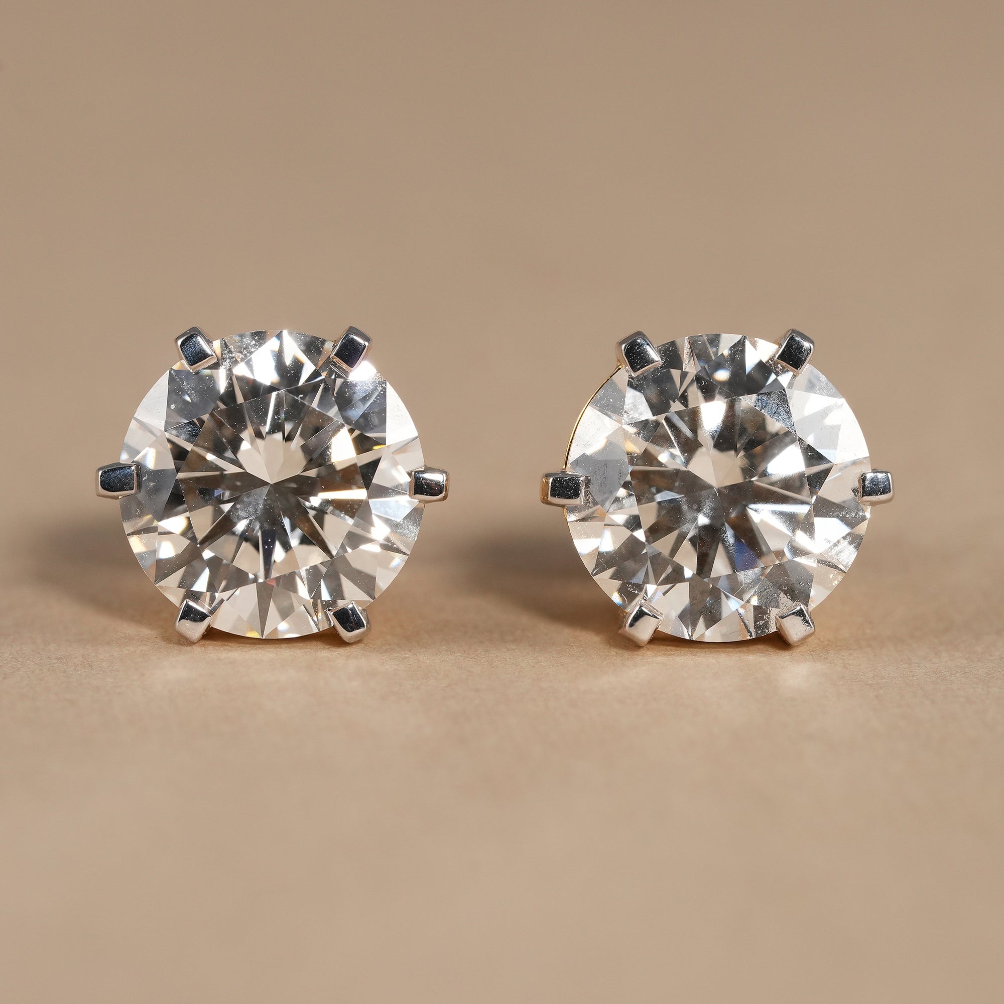 Round lab grown diamond solitaire stud earrings with secure six prong setting in solid gold