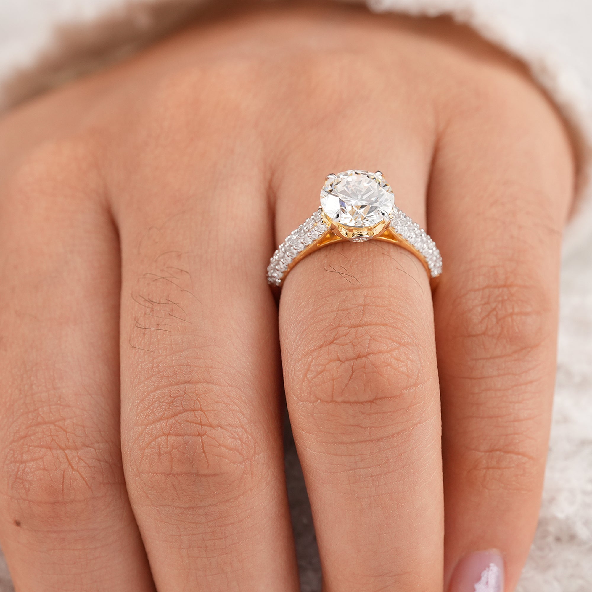 Timeless round diamond proposal ring with brilliant pavé detailing
