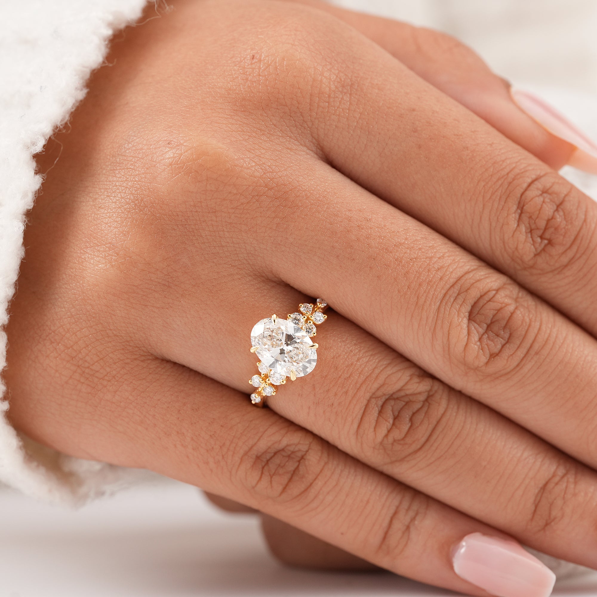 Handmade oval diamond ring with elegant floral cluster accents