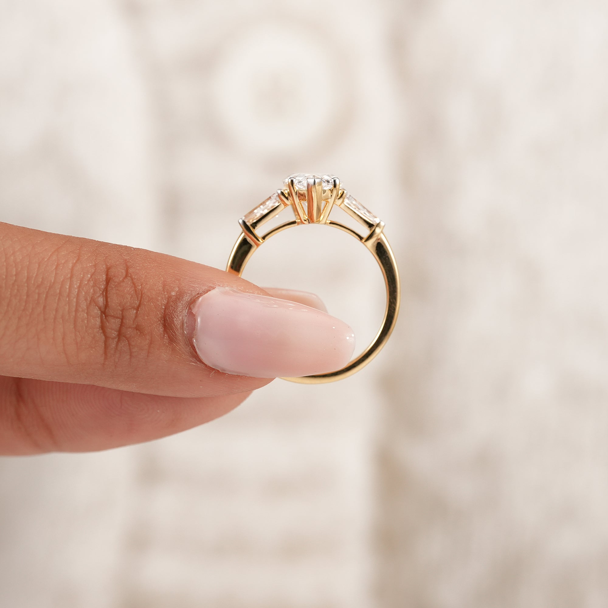 Women's pear diamond ring with tapered baguette accent diamonds