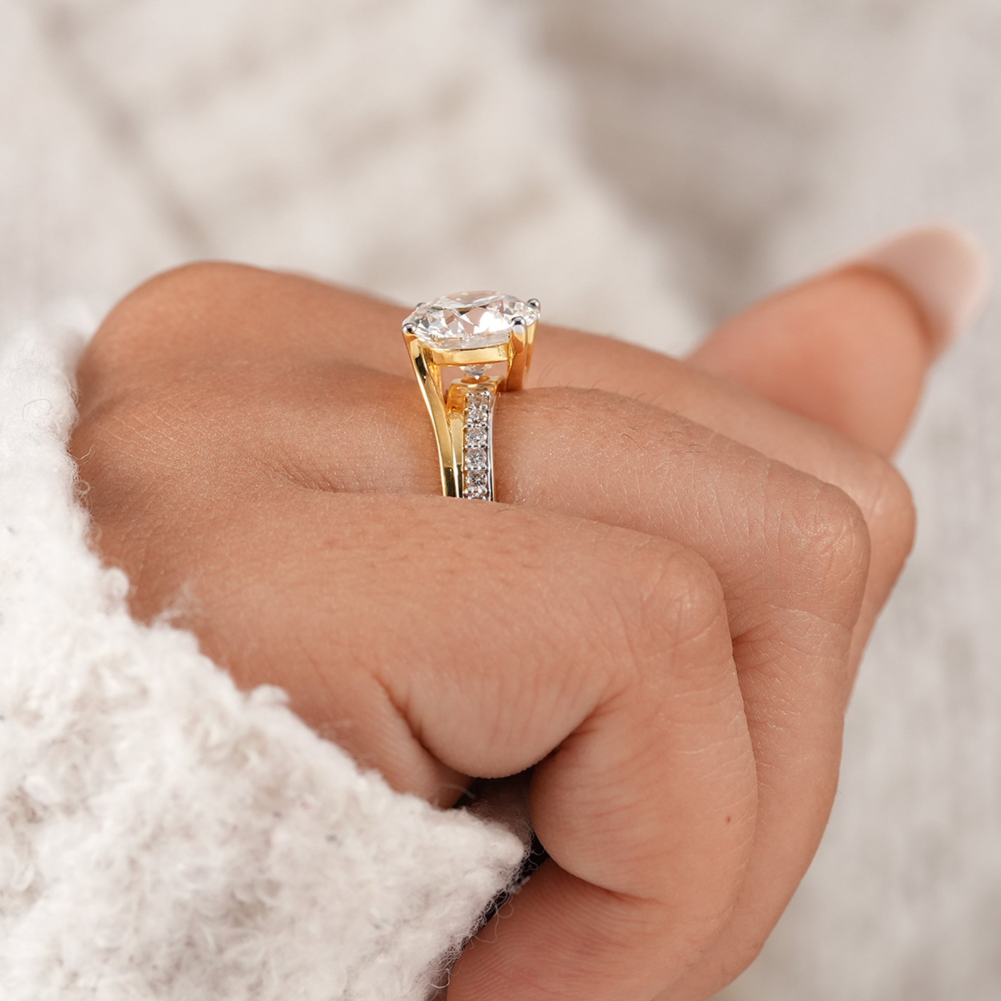 Timeless round brilliant engagement ring with pavé diamond accents