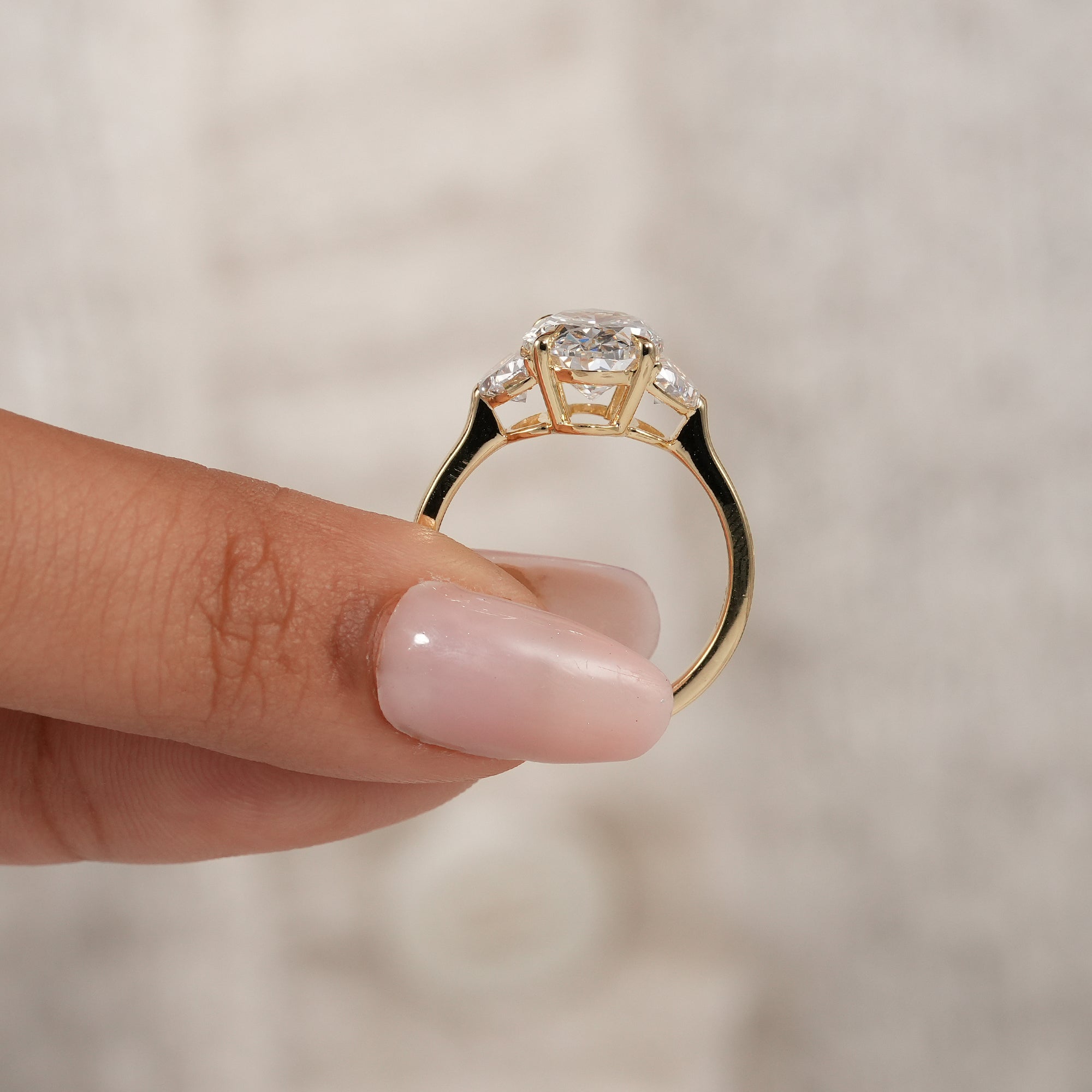 Oval anniversary ring with sparkling three stone lab grown diamond design
