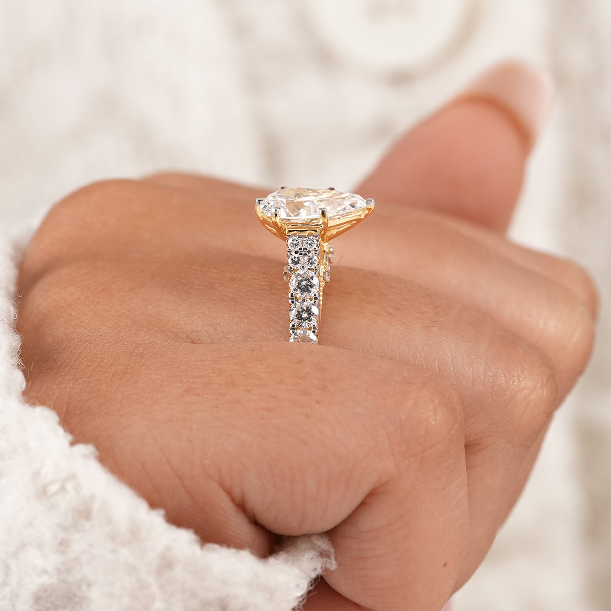 Vintage pear diamond anniversary ring with pavé diamonds