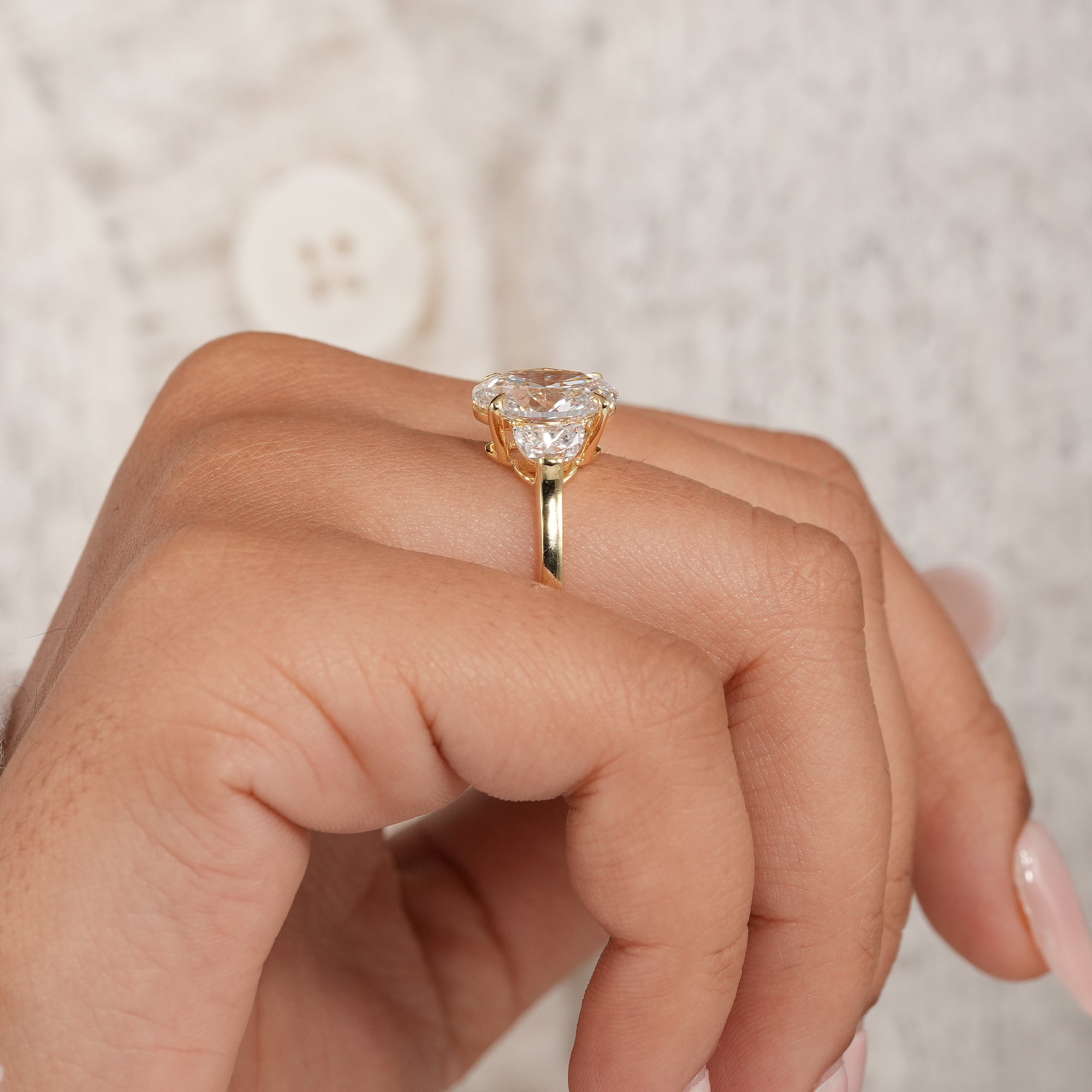 Handmade oval lab diamond bridal ring with polished gold comfort band