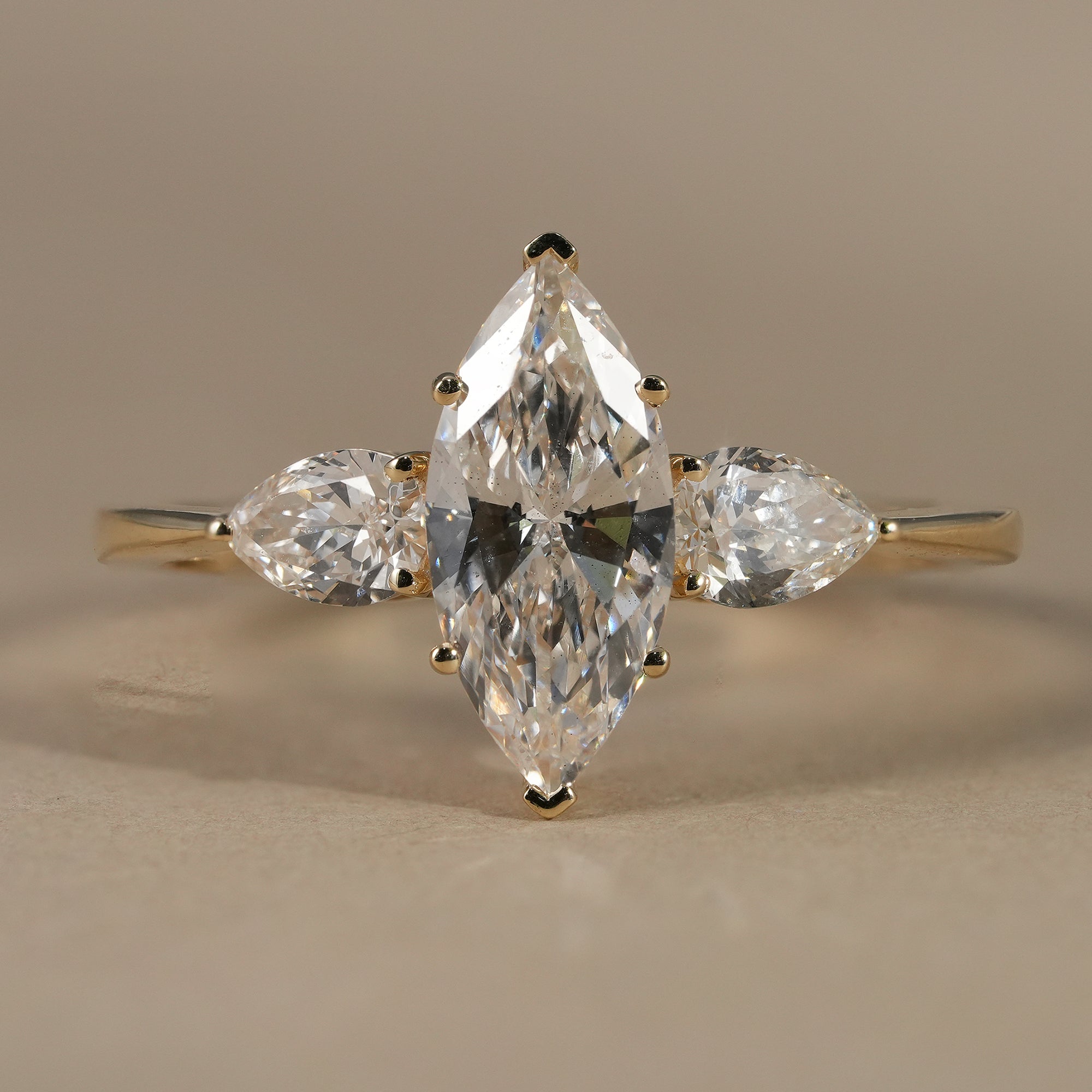 Three Stone Marquise Cut Lab Diamond Engagement Ring With Pear Side Stones