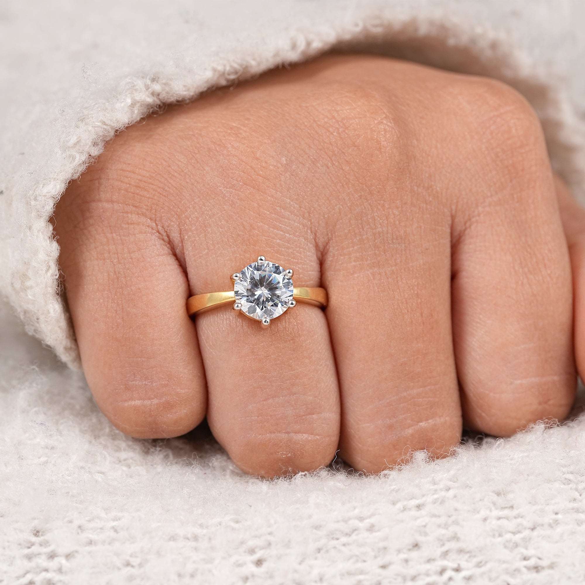 Luxury round cut solitaire engagement ring with two tone gold prong design
