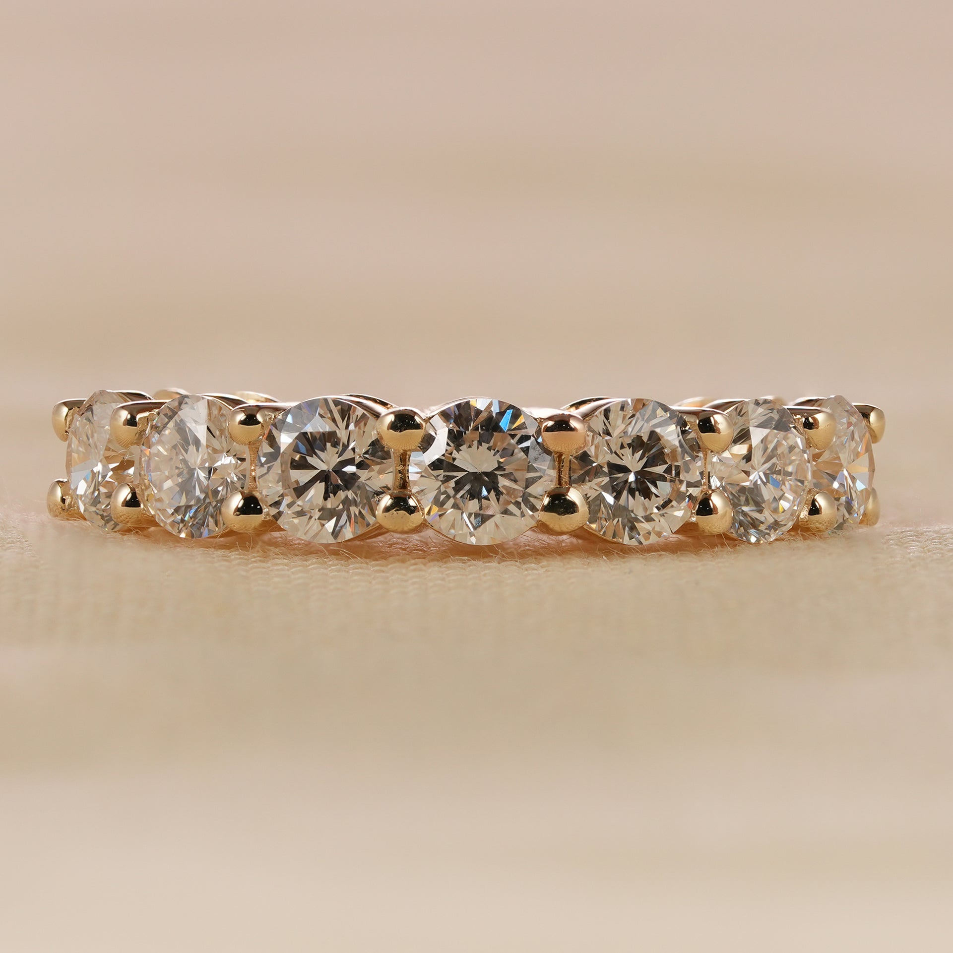 Classic 7 stone round cut lab diamond wedding band in yellow gold