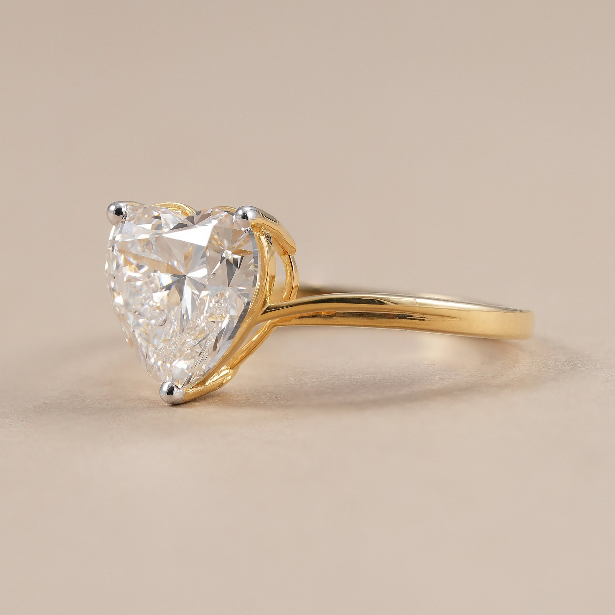 2.9 CT heart shape lab diamond ring with elegant bypass setting.