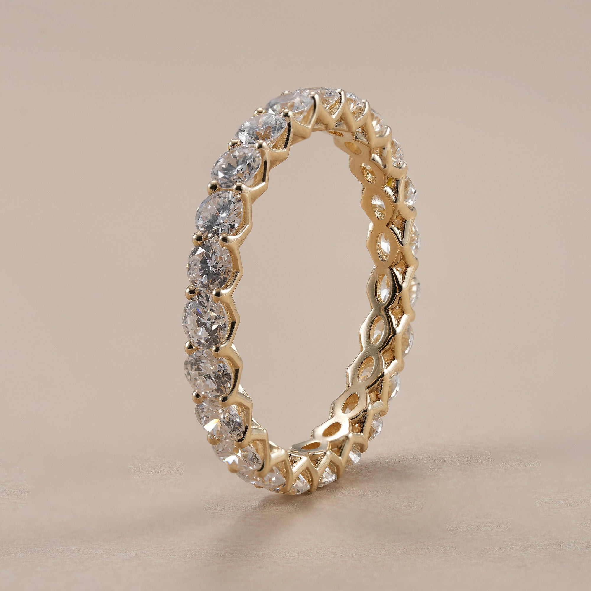 Minimalist stackable round diamond eternity ring for women.