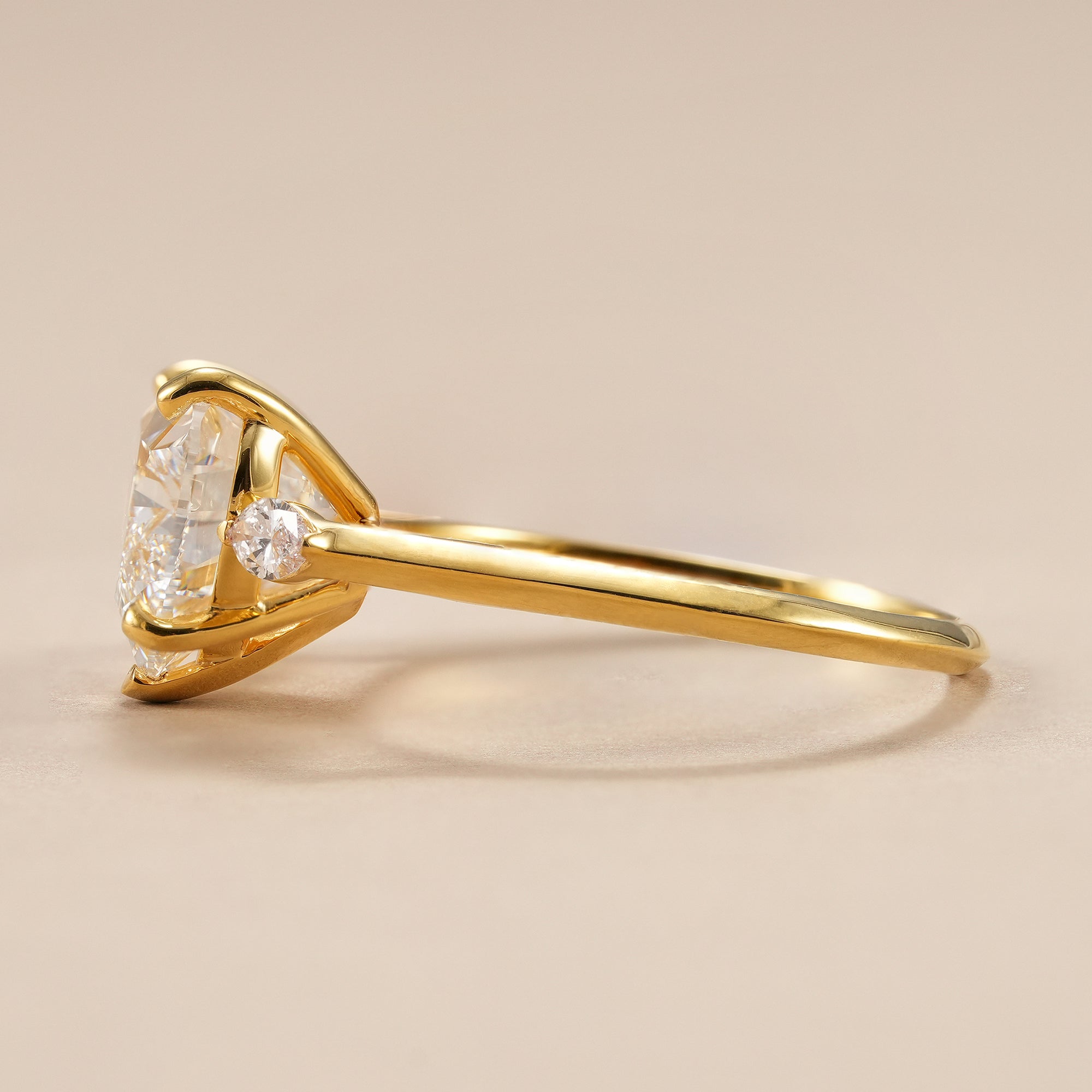 Three stone heart diamond ring featuring pear accent diamonds.